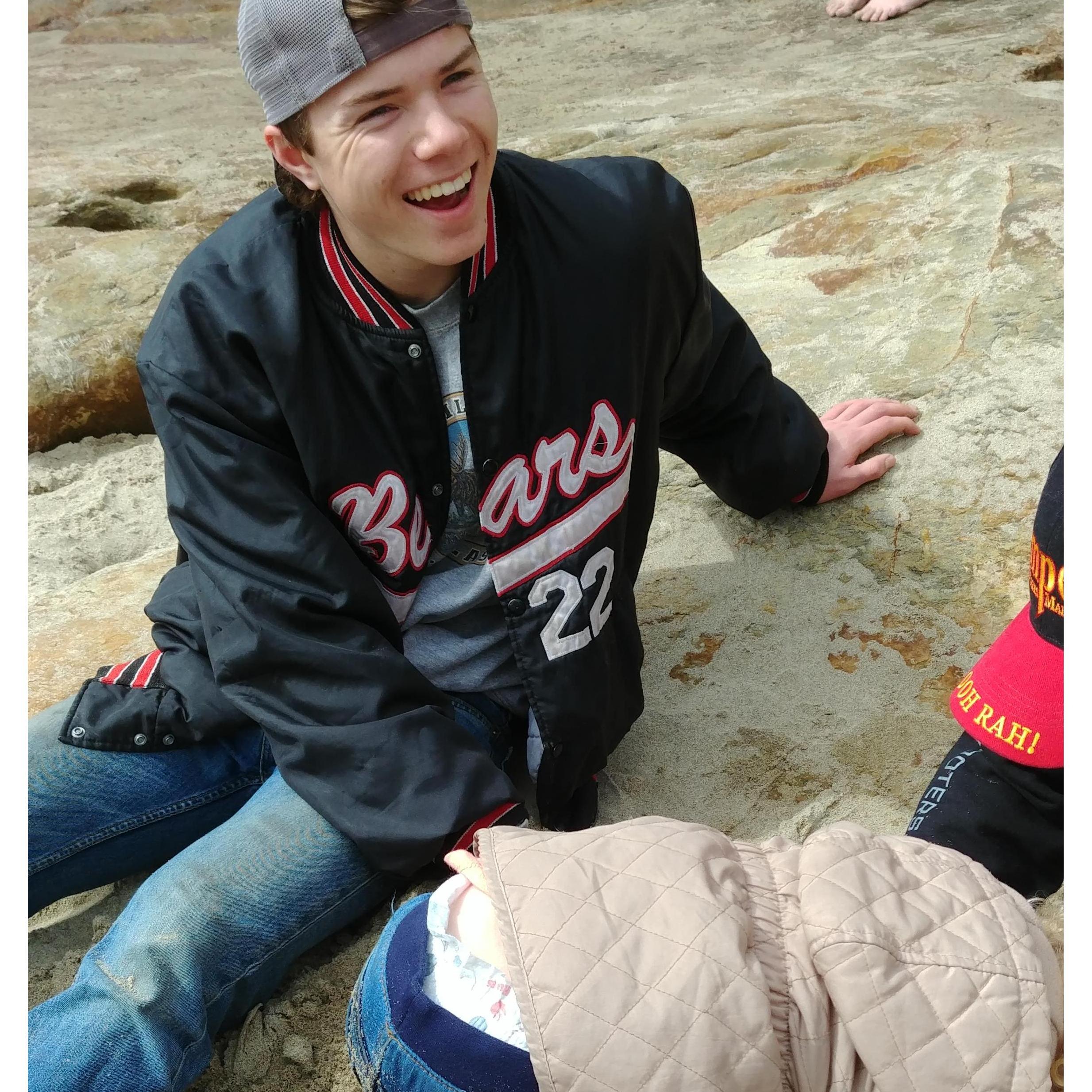 Jesse and Trey playing with Emmaline in the sand