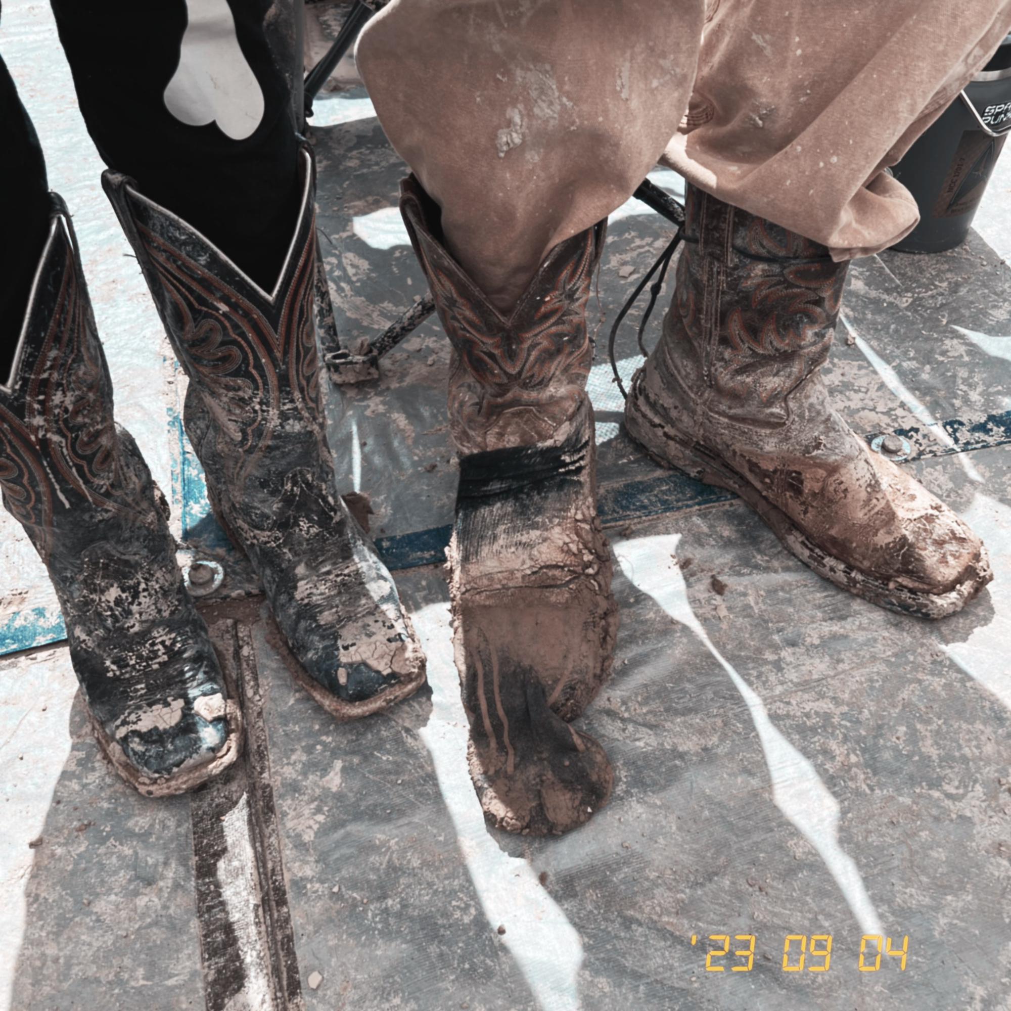 How muddy our boots got from the days storms on playa