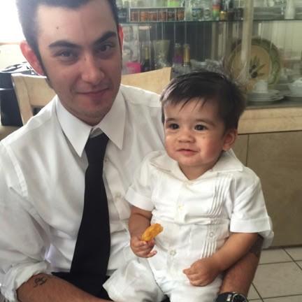 The groom and the ring bearer Adrian.