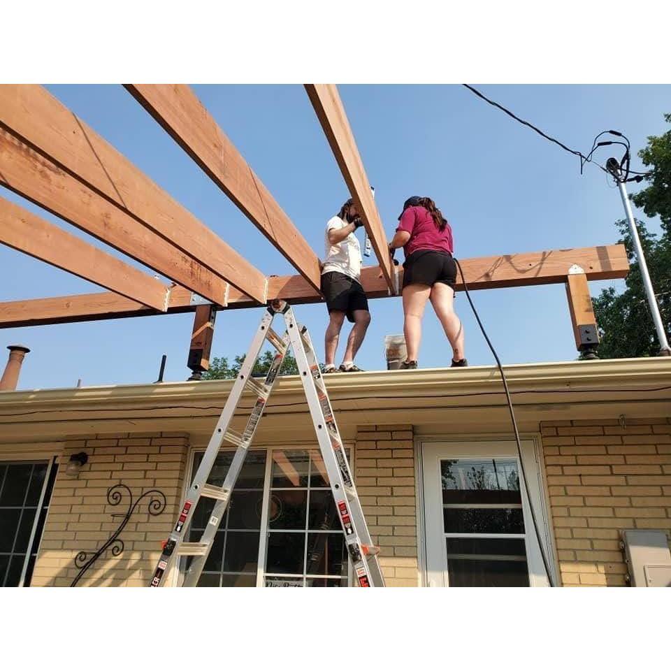 Us on the roof attaching rafters!