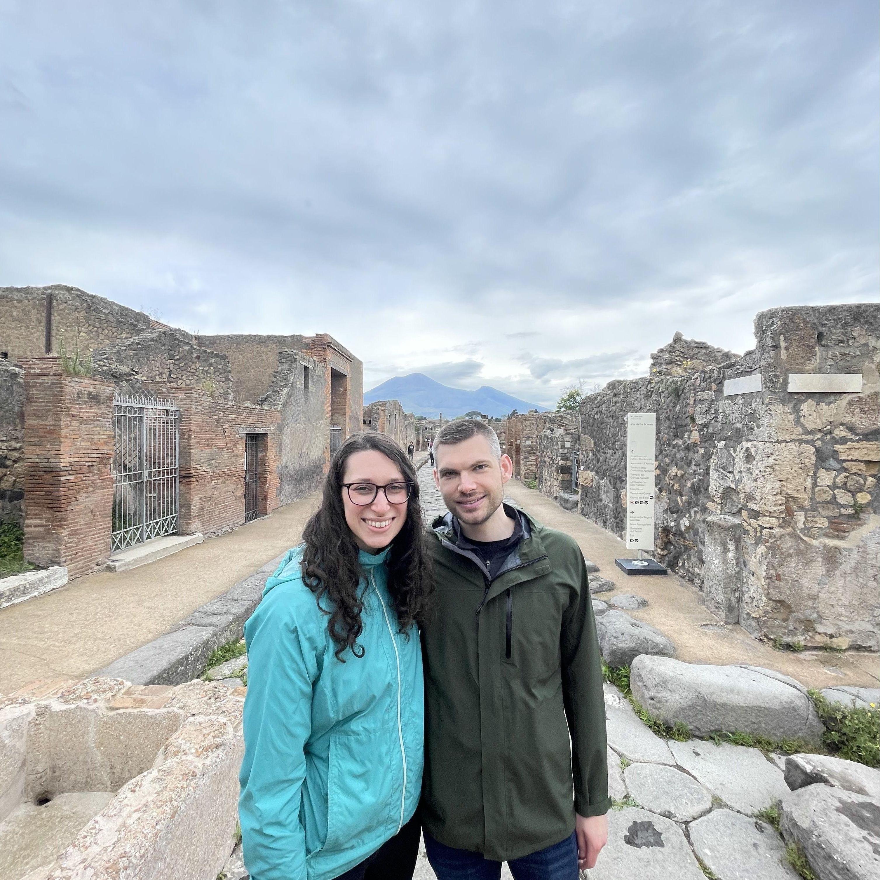 Standing in the Pompei ruins with Mount Vesuvius behind us,