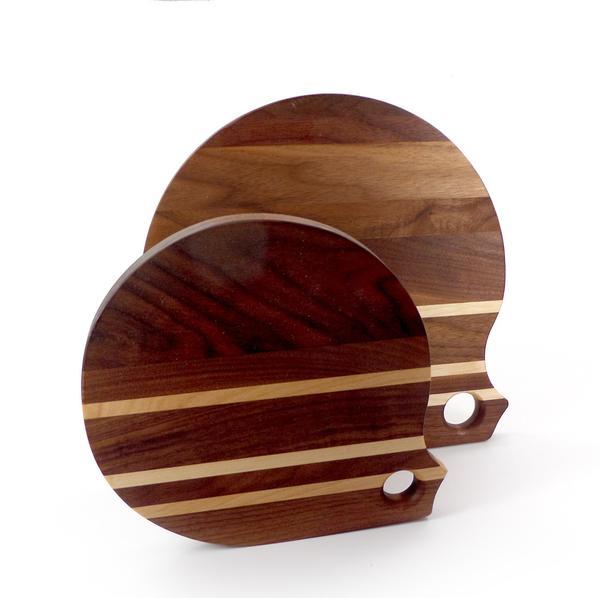 Round walnut cutting boards with birch stripes