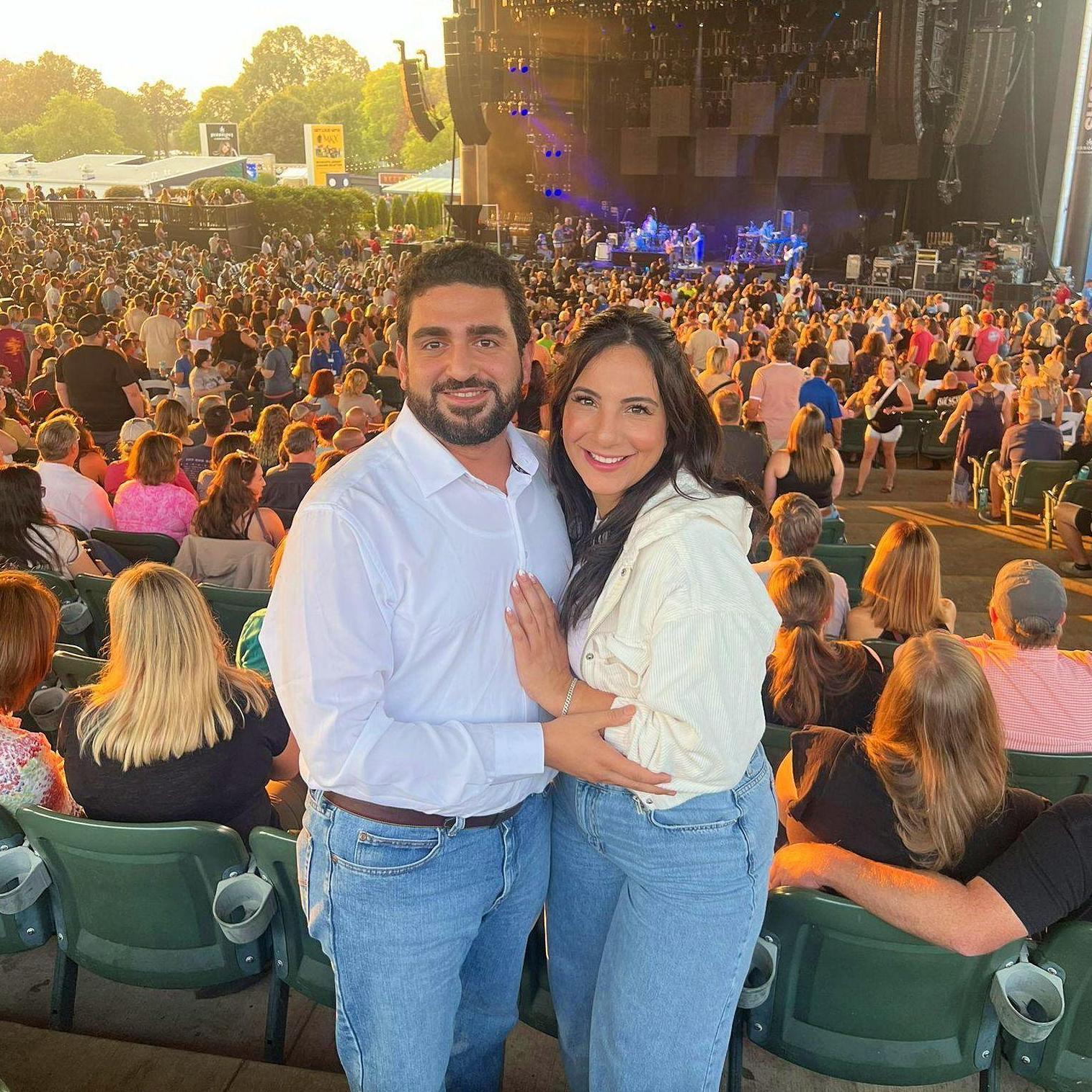 Attending our first date song in concert! Also our first social media photo together!