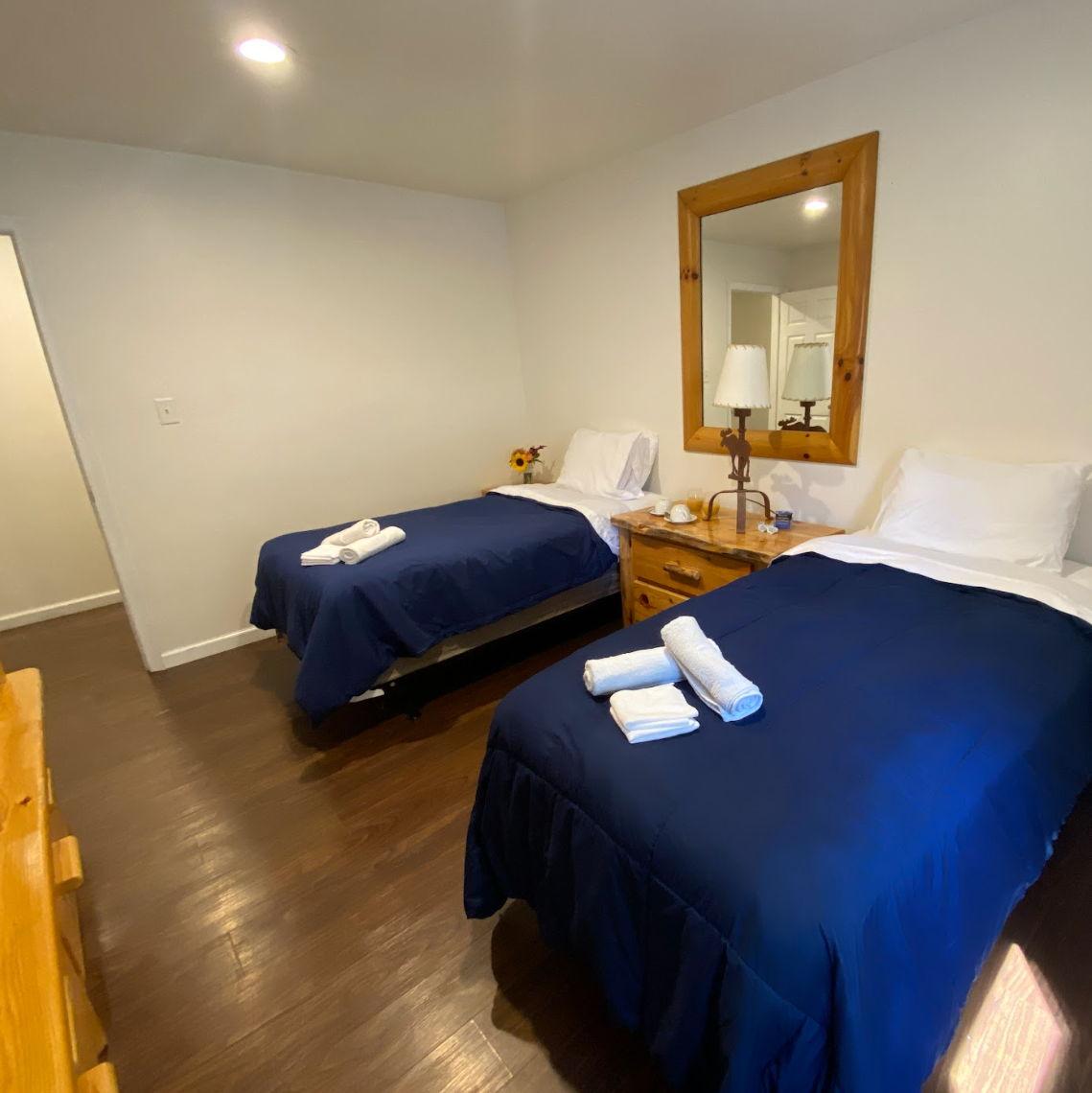 Sneak peak at the private accommodations at Camp Lindenmere - room with a queen size bed!