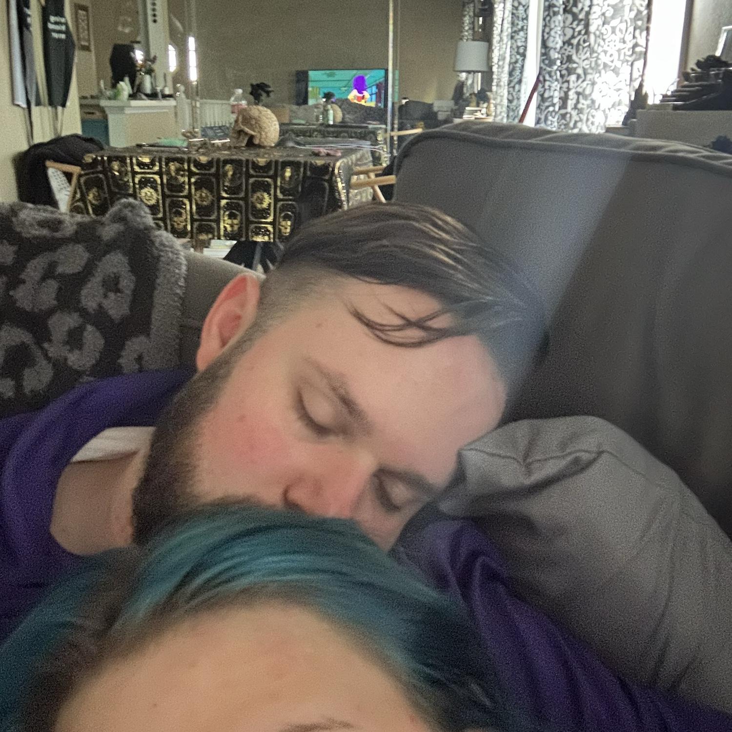 Laney recovering from brain surgery - with a sleepy Garrett. July 2023.