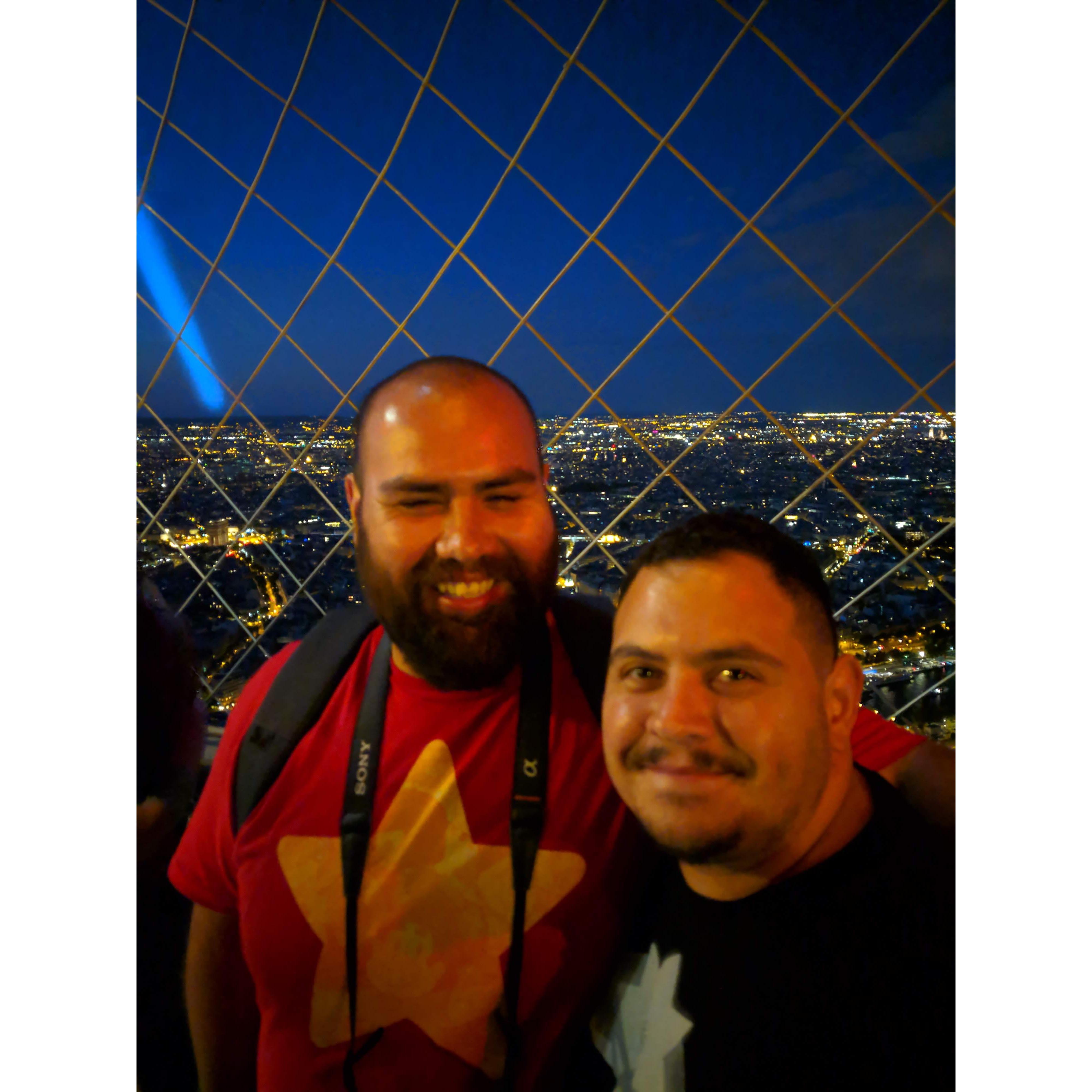 At the top of the Eiffel tower. Doug giggling at Rene's fear of heights