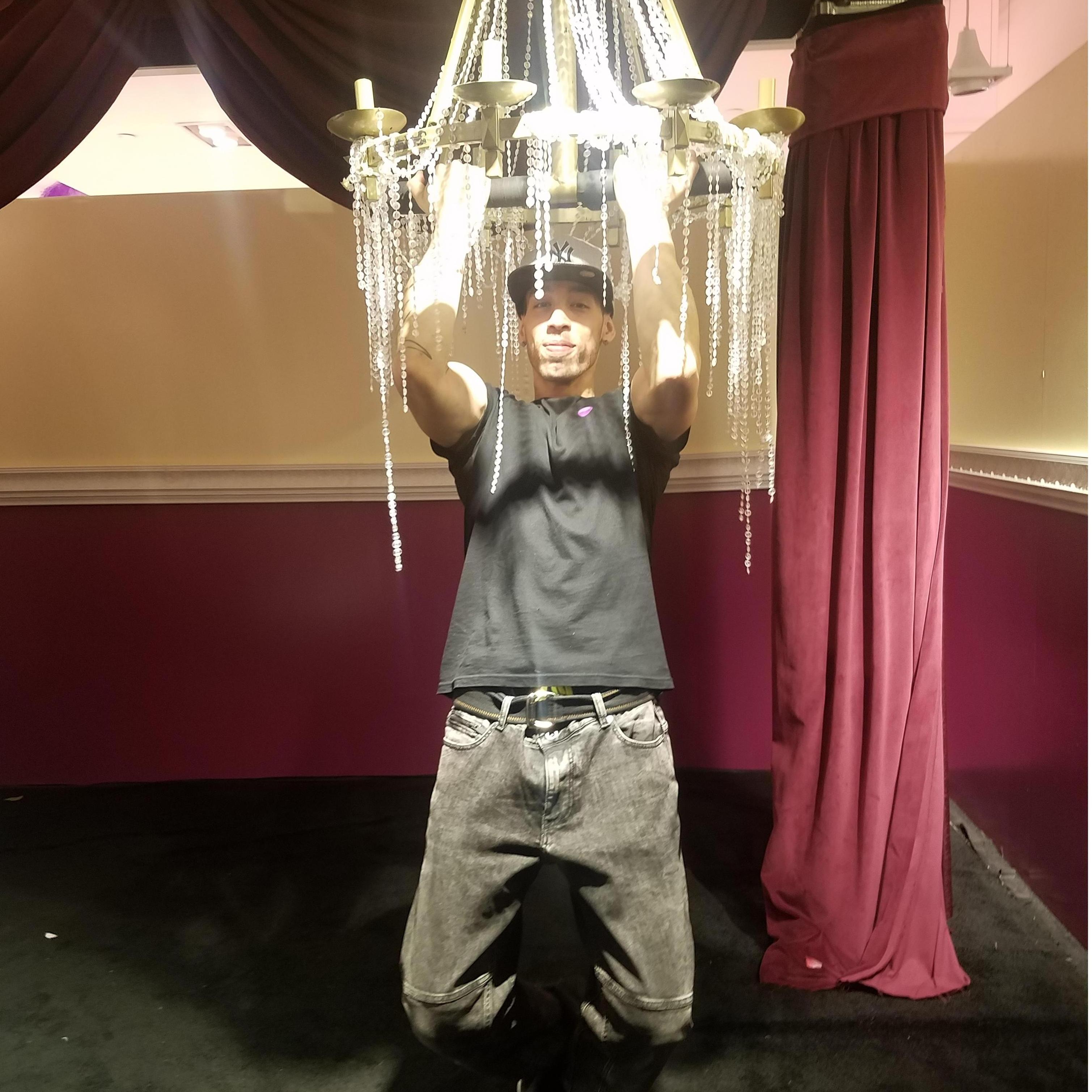 Cody Swinging from Chandeliers at the Rose Mansion.