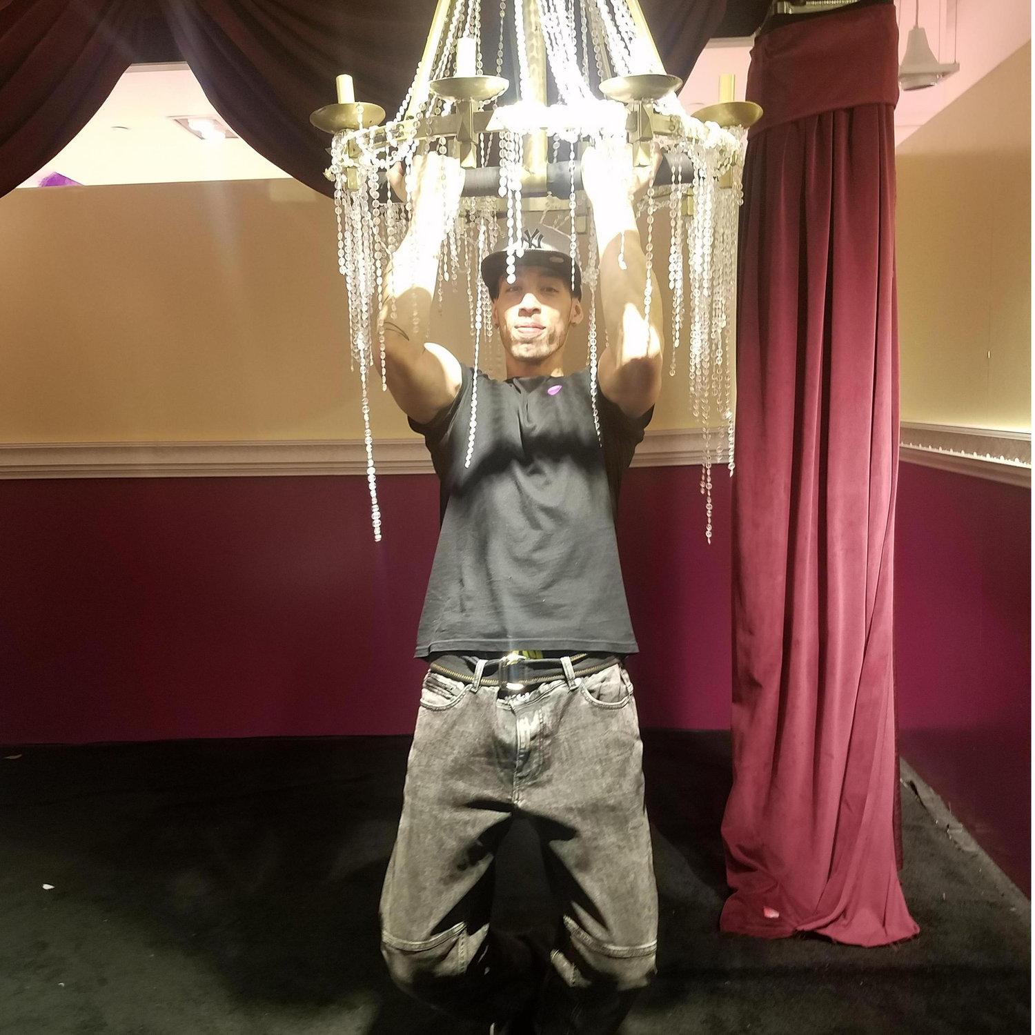 Cody Swinging from Chandeliers at the Rose Mansion.
