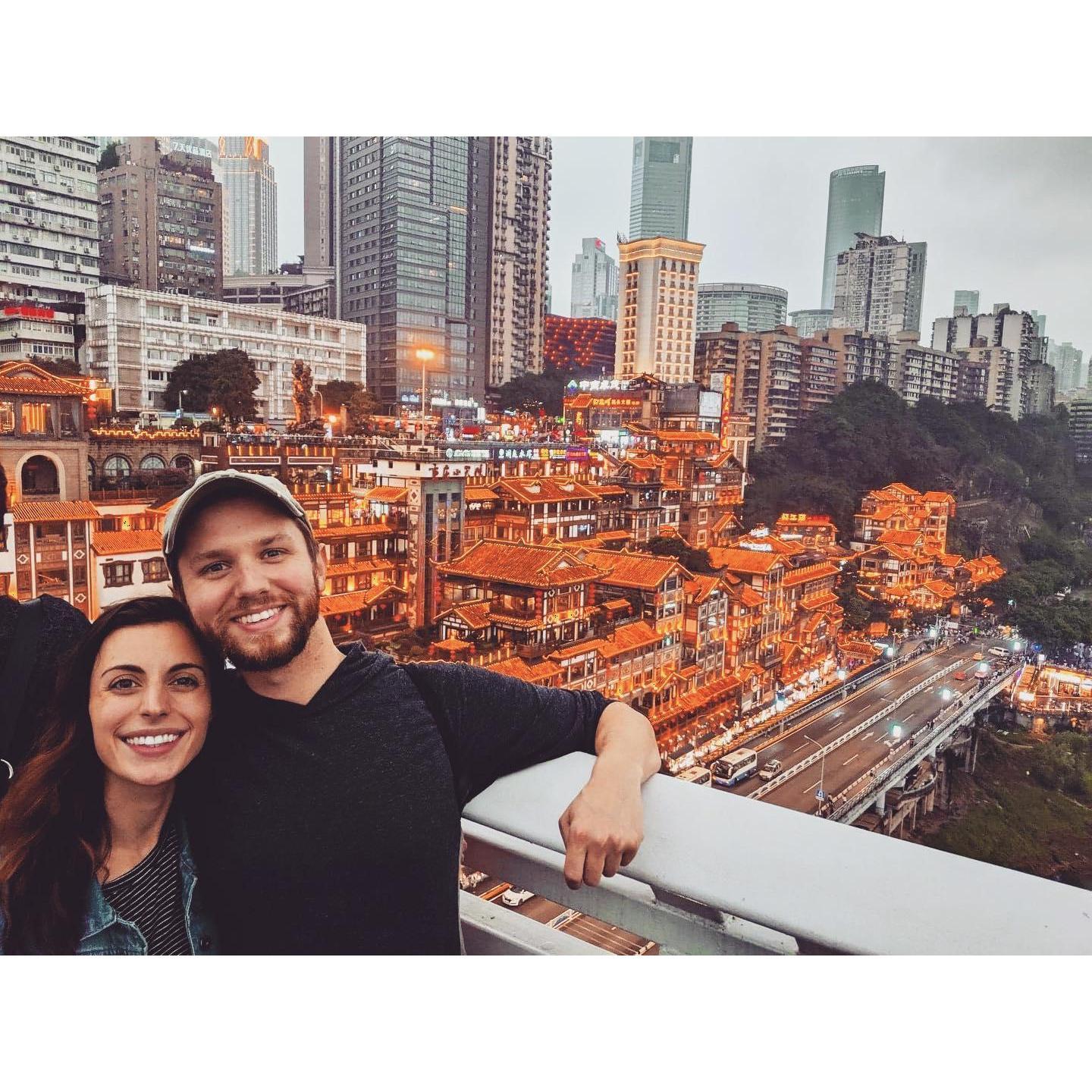 In front of the Hongya Cave in Chongqing, China. This was our 3rd city in China. Moments later, Chris was hit in the head with a meatball by a street vendor. Seems about right.