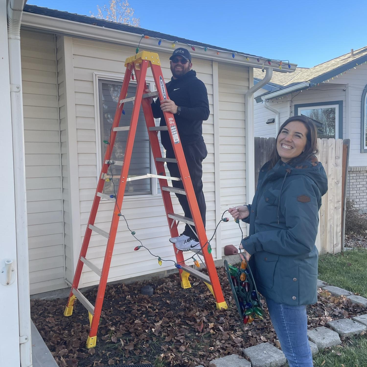 Hanging Christmas lights on the new house for the first time! ❤️💚