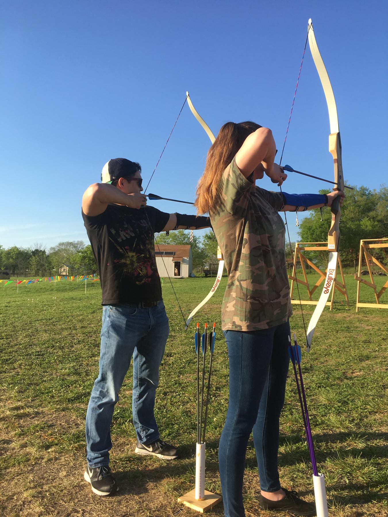Evelyn beat Sam in an archery competition!