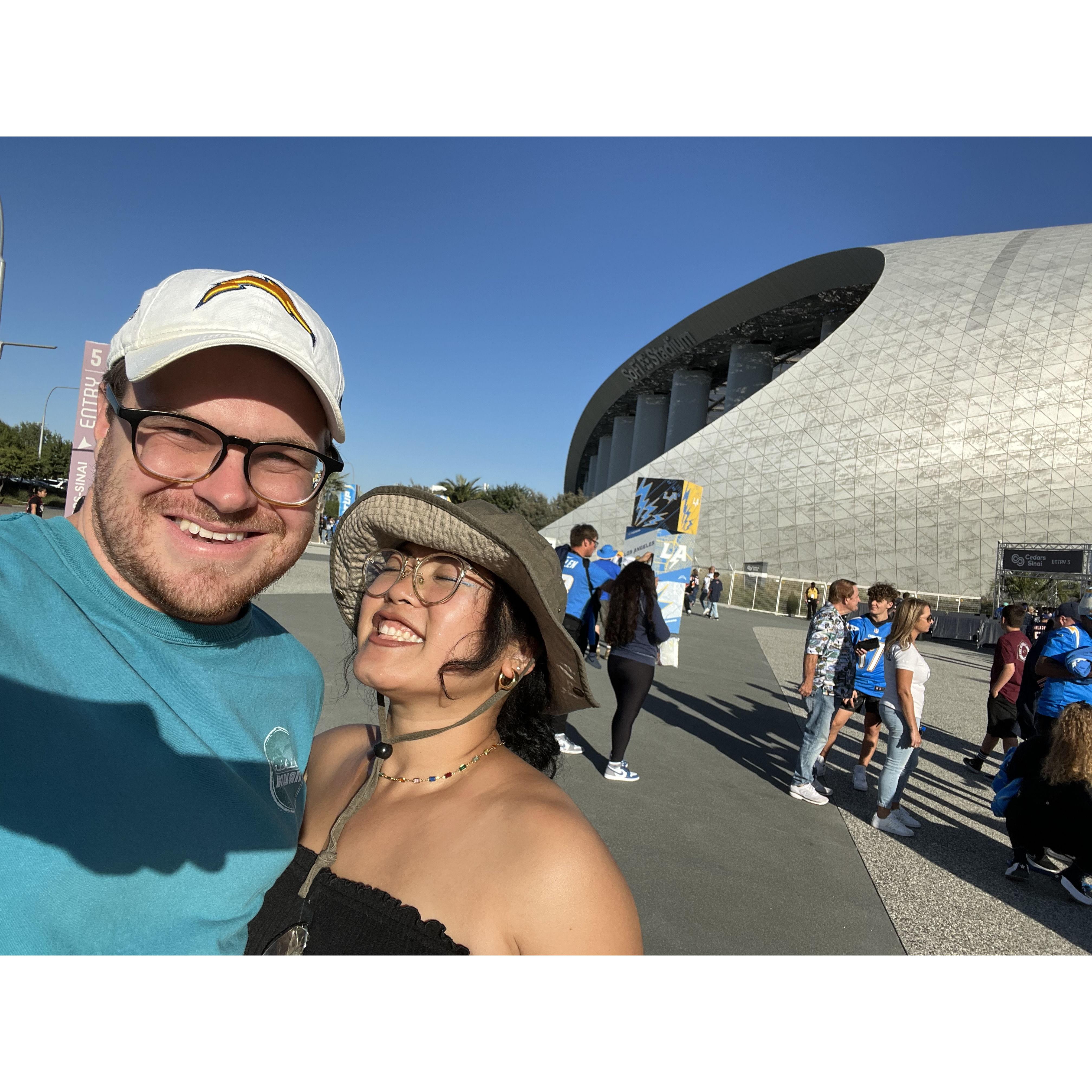 Daniel's parents gave Daniel and Ariana tickets to see the Chargers at the new Sofi Stadium. Ariana joked that she's been a Chargers fan far longer than Daniel.