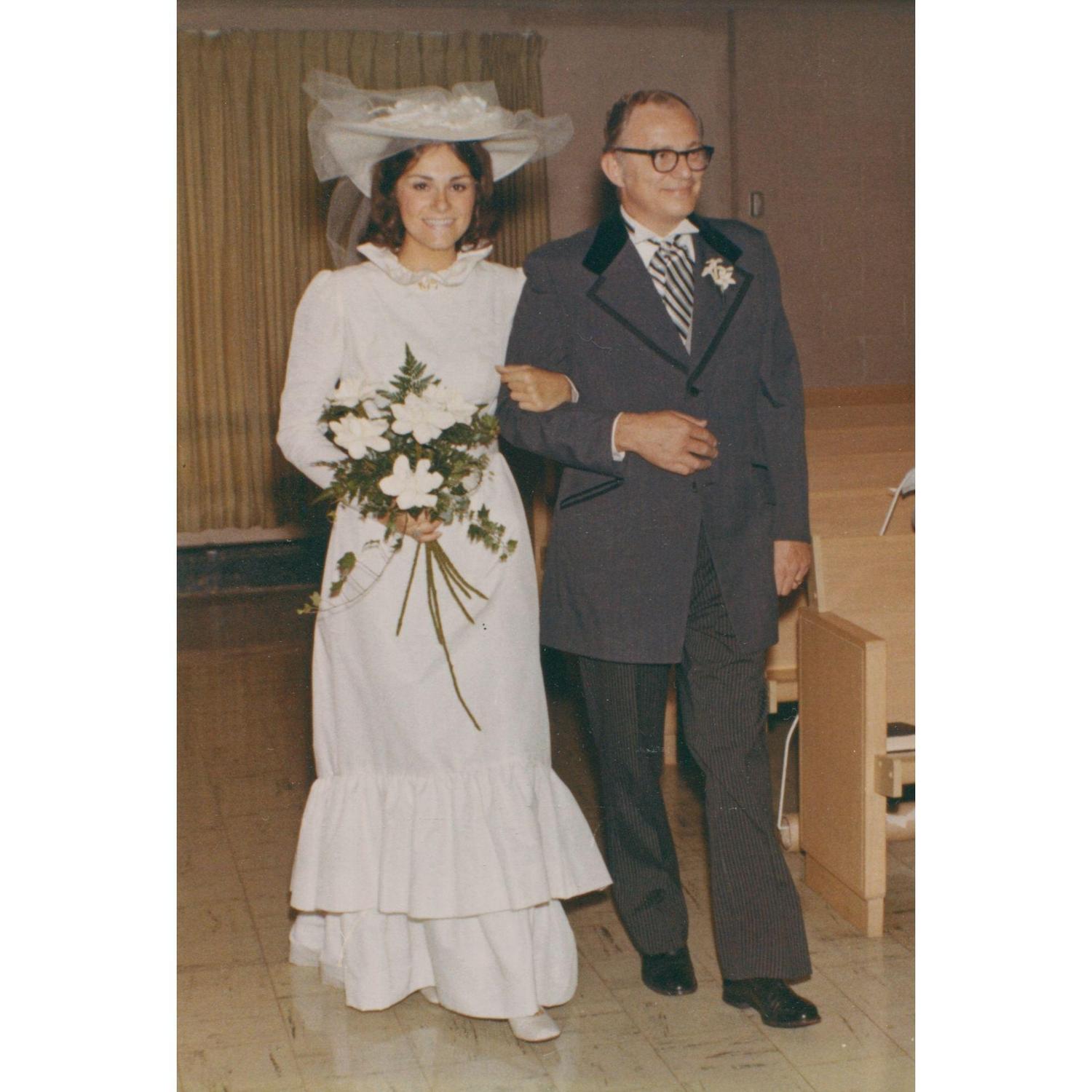 Gail being walked down the aisle by her father, Robert