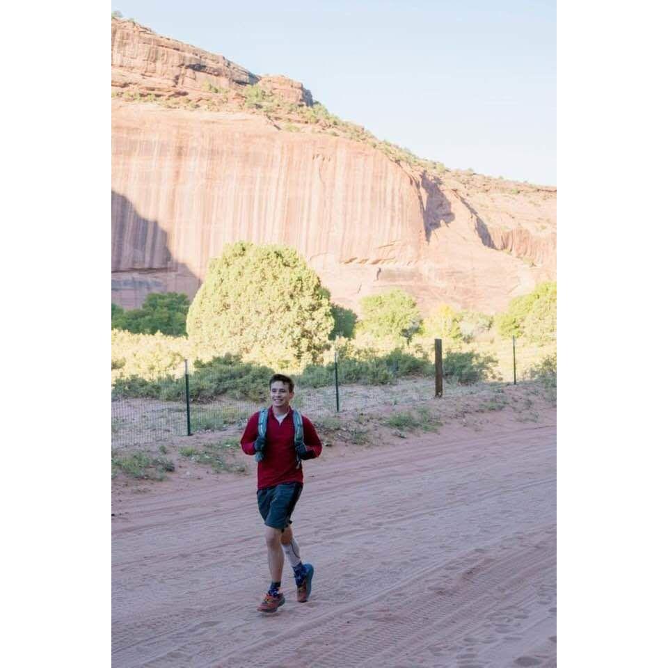 Alex running Canyon de Chelly Ultra in 2020. Rosa met him at the finish line where he brought back mini-sized chocolates for her from the race.