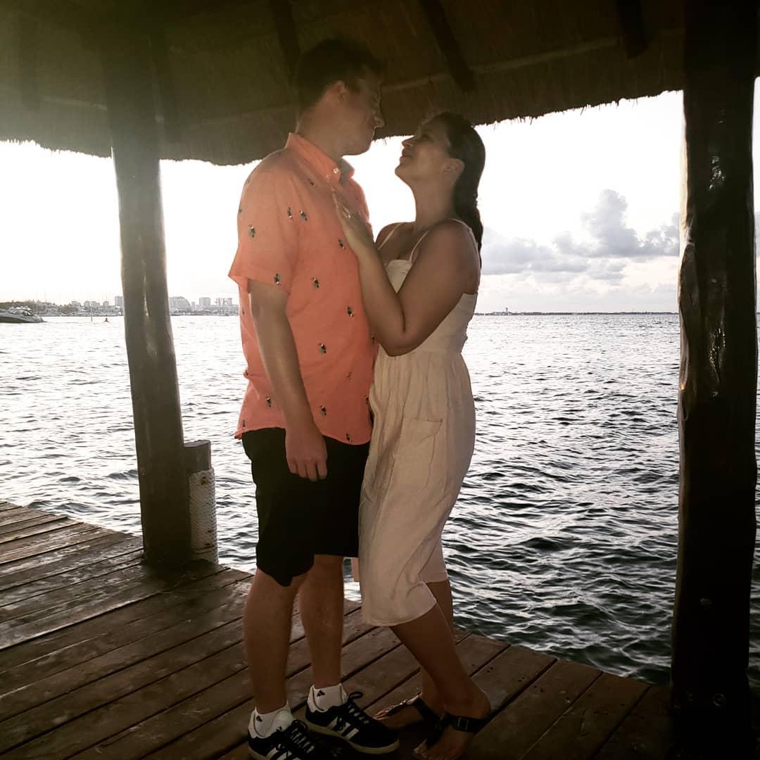 Taken on the dock of our resort after DJ proposed... what you don't see is the Cancun "pirate ship" playing music in the background.