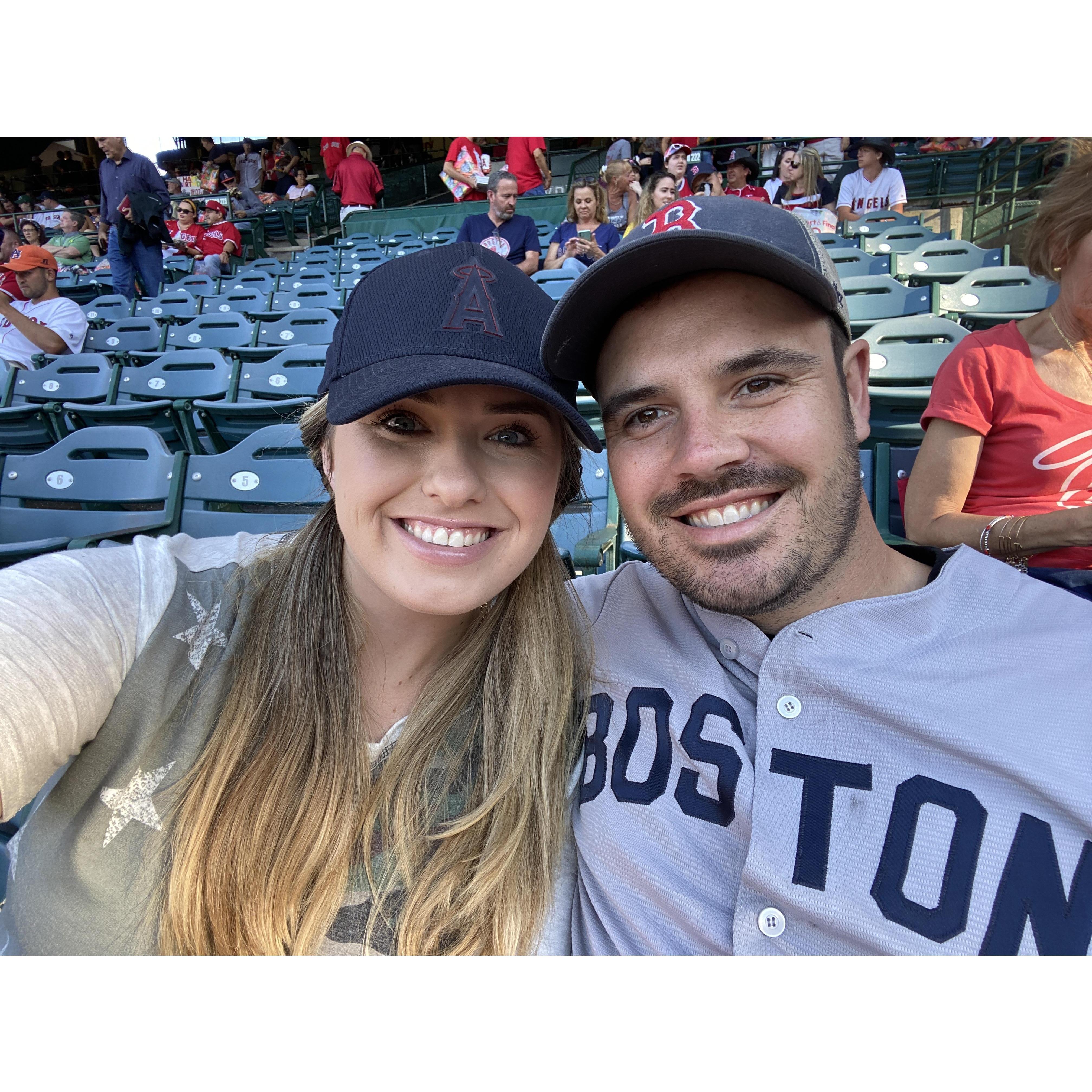Enjoying a baseball game together... only one of us enjoyed the end score.