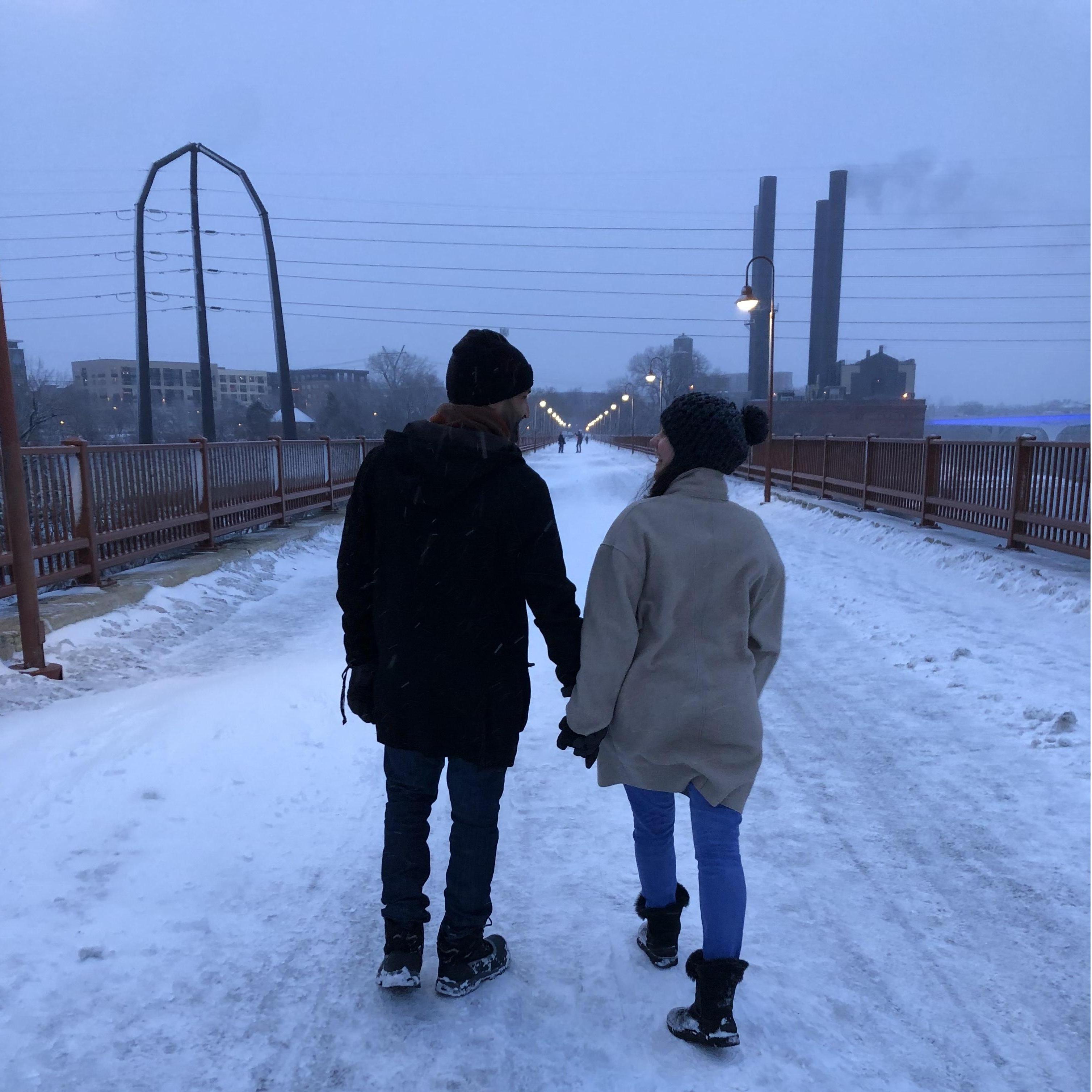 Walking on the Stone Arch Bridge over the Mississippi River after our engagement!