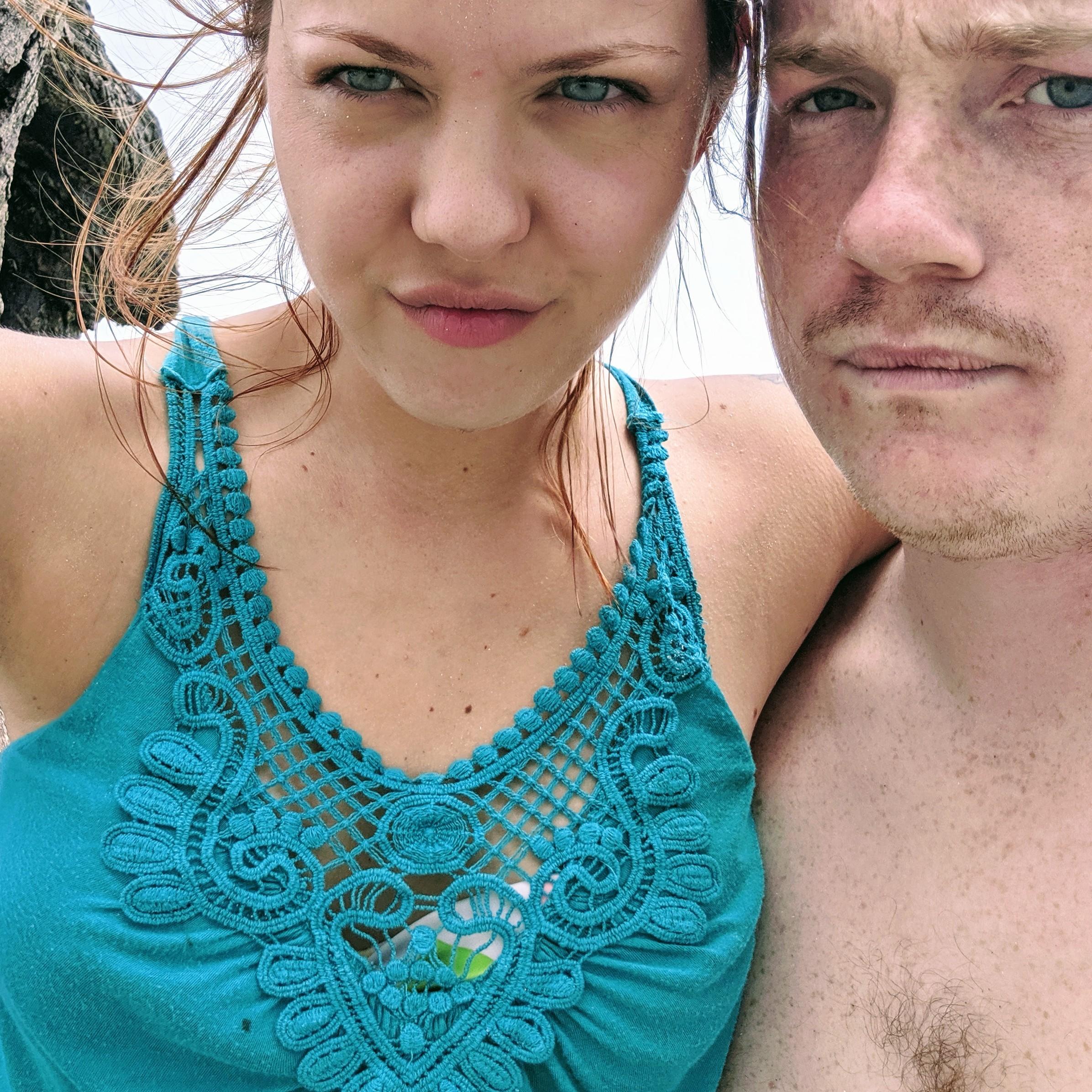 Blue eyes and Auburn hair.