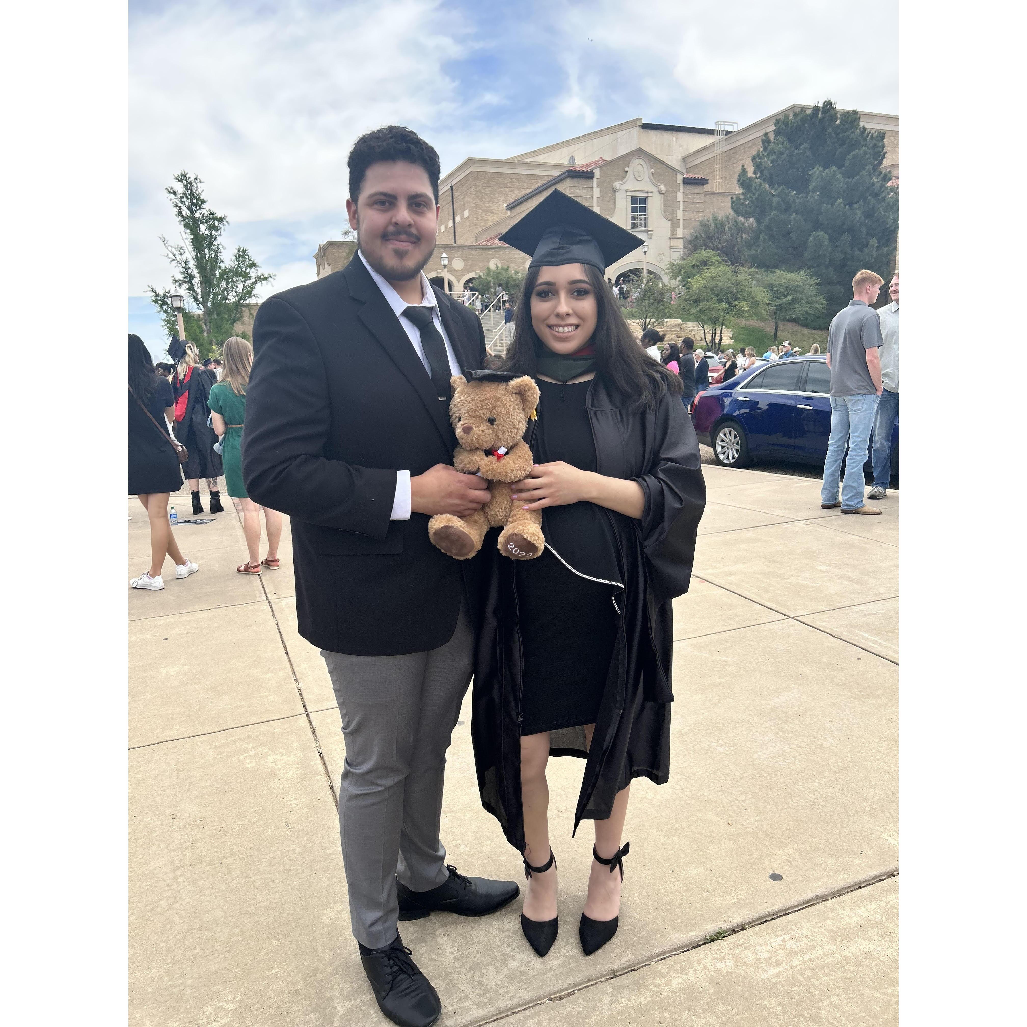 A man supporting his lady on getting her Master's degree
