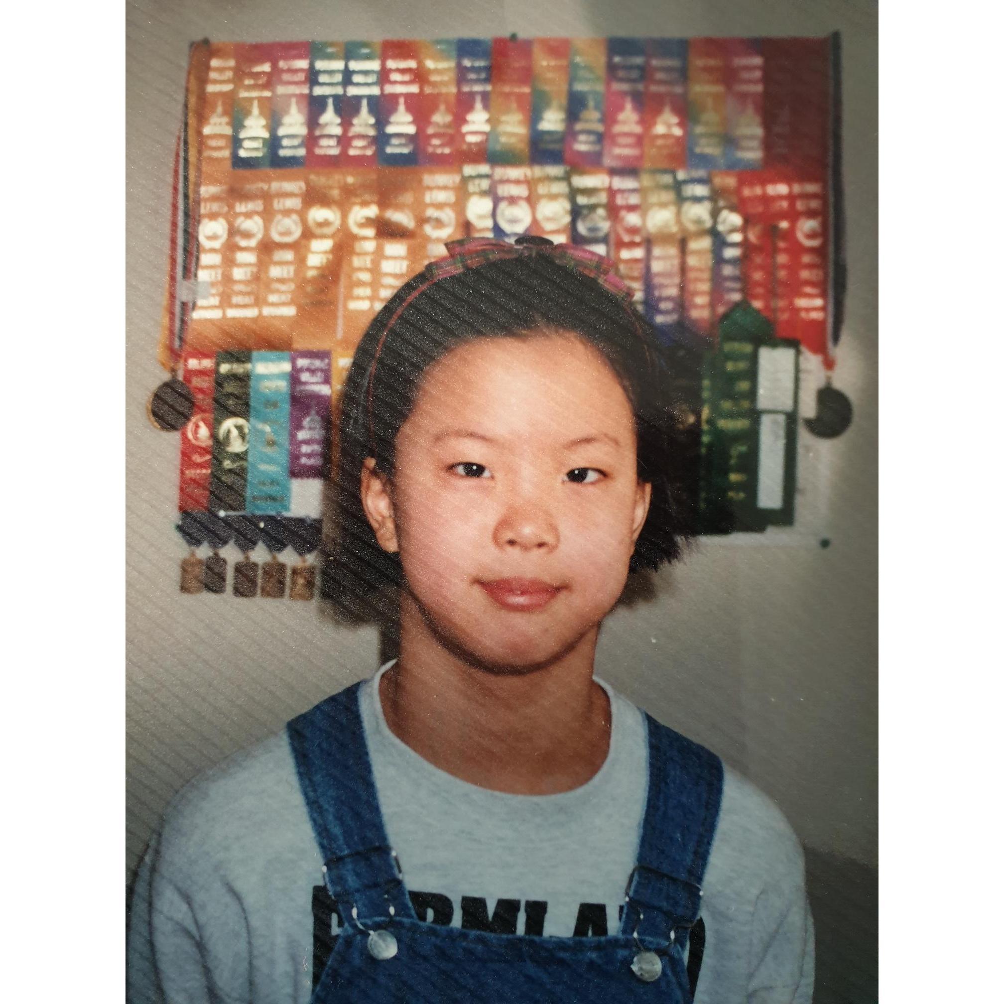 Awkward HeeJin in front of her swimming ribbons!