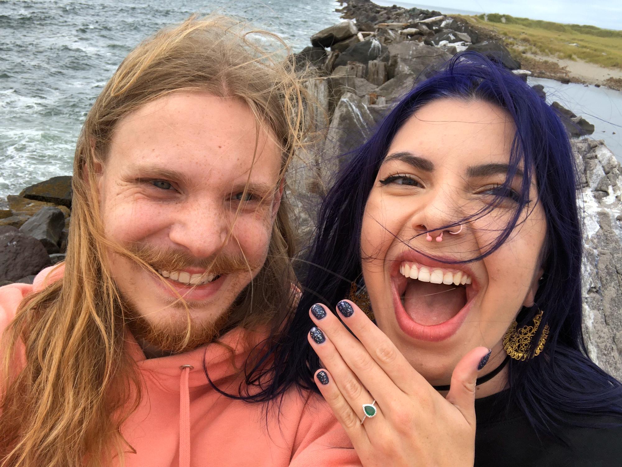 The Engagement! August 2019. Caleb didn’t need to kneel because he was below Allie on a jetty.