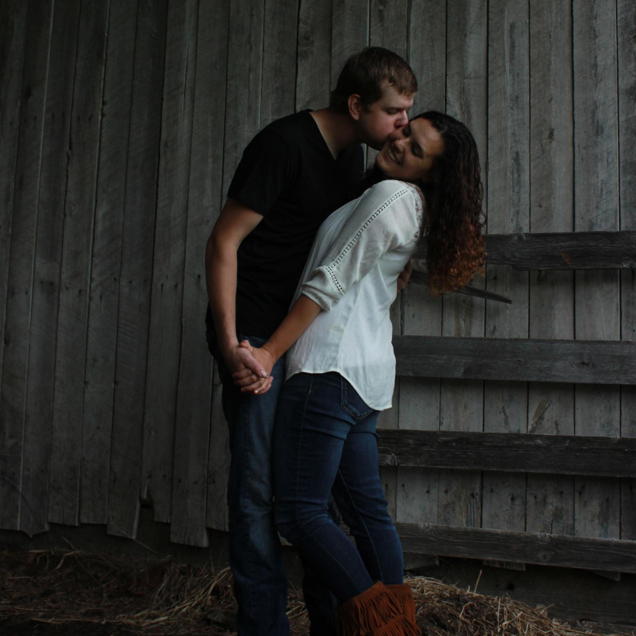 We had to hide from the rain the whole time we were taking engagement pictures.