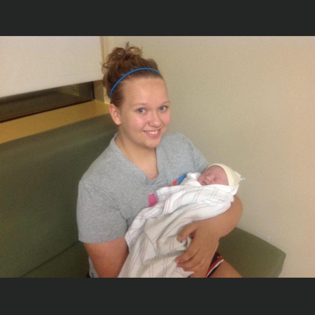 This is a picture of me while i was in 9th or 10th grade hold baby parker at he hospital after my seester Mandy had given birth. Parker is one of our ring bearers!
