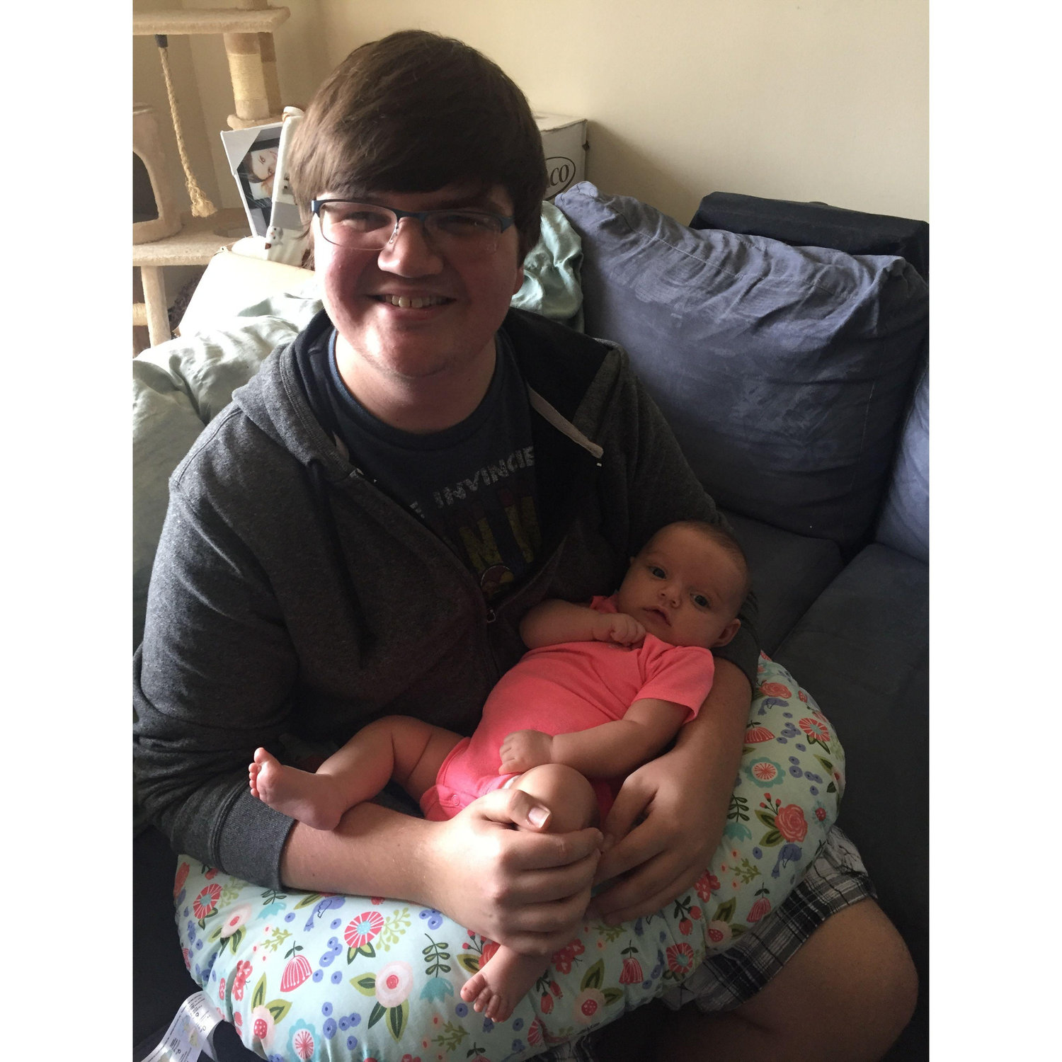 Justin holding newborn Mia, his Niece and a flower girl April 2017