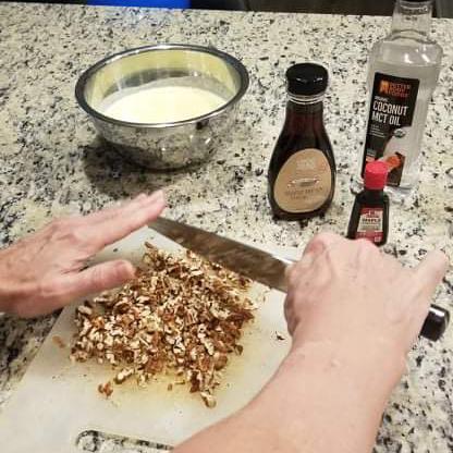 Jon chopping pecans for homemade keto butter pecan ice cream
