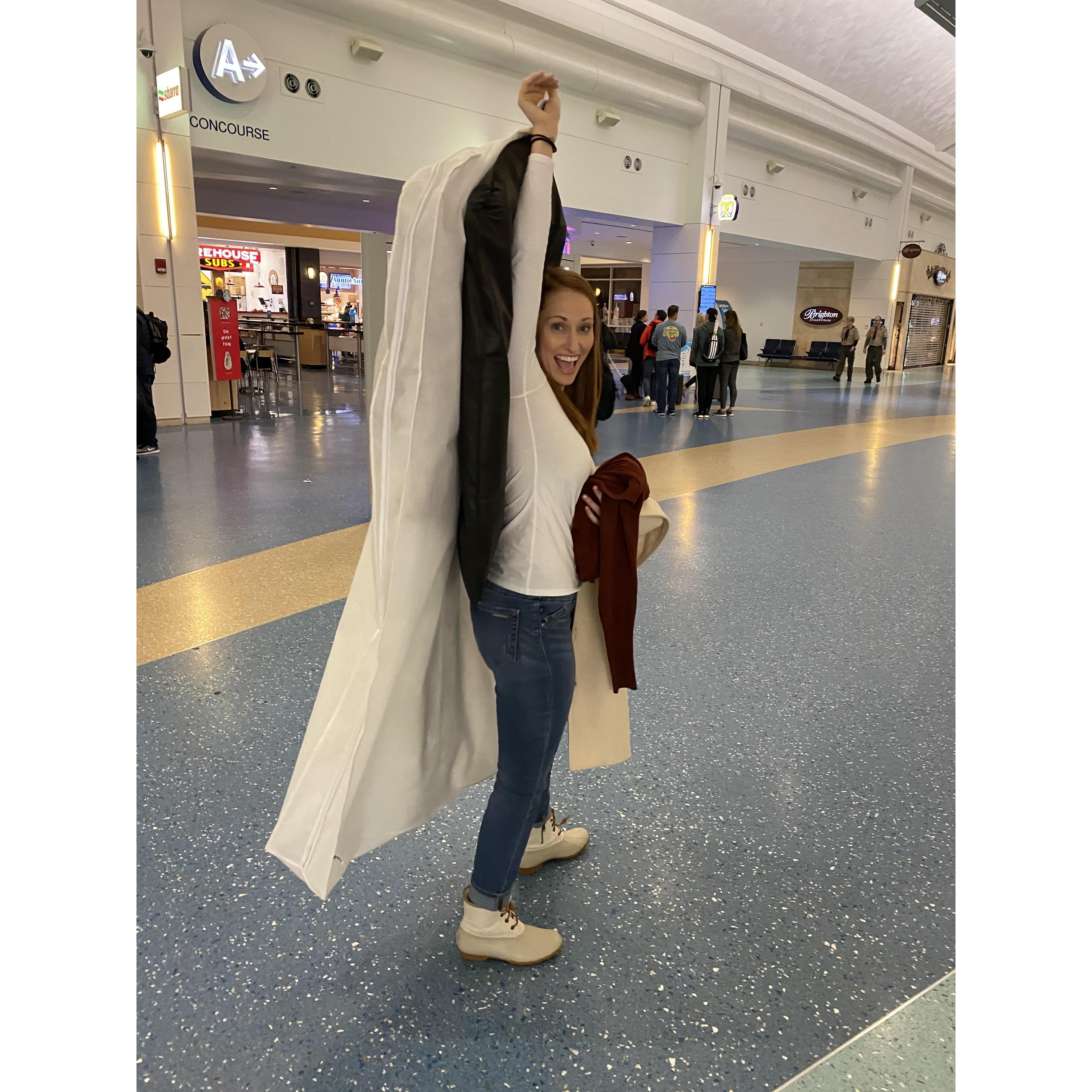 Carrying on a wedding dress on a regional jet is not the easiest endeavor