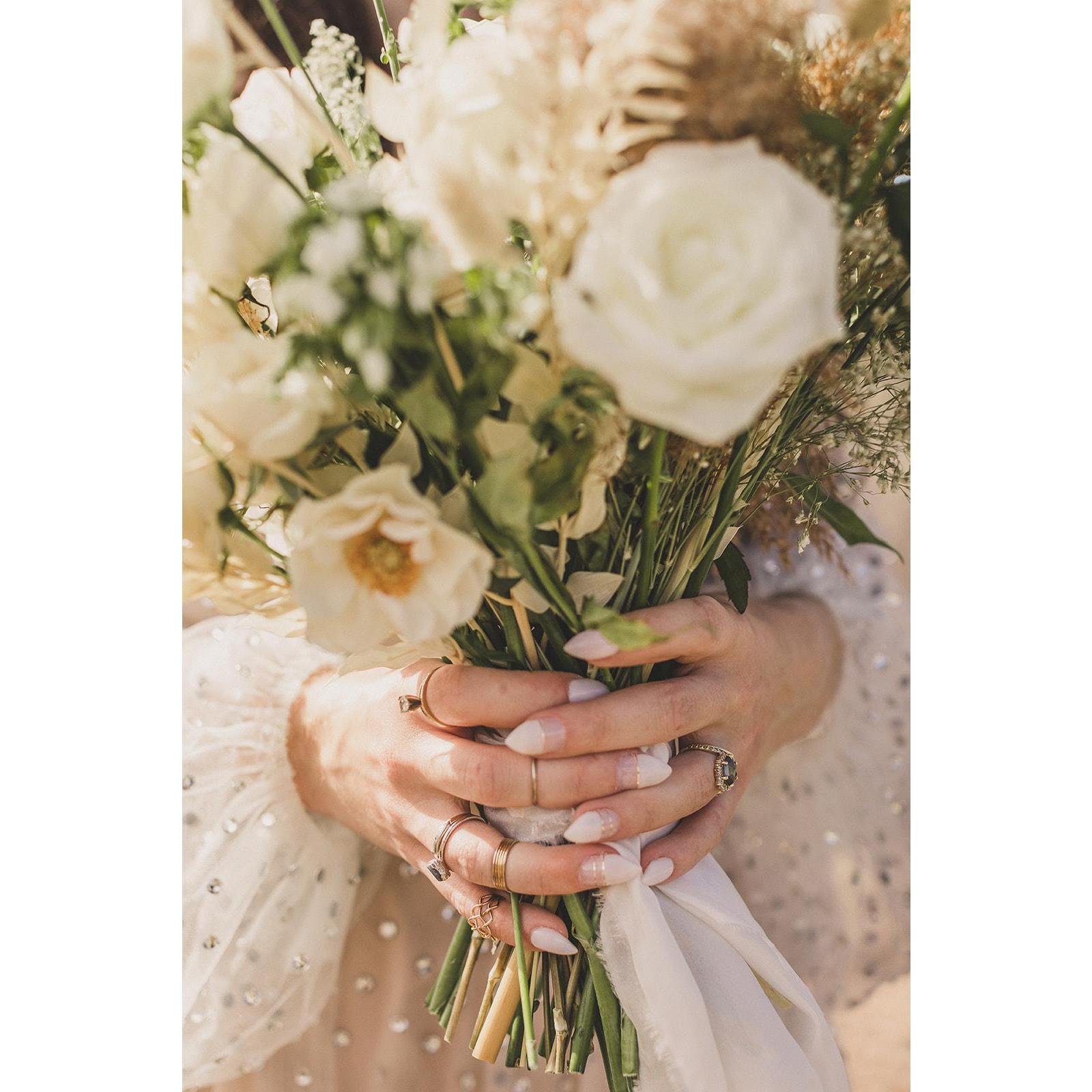 Wearing a ring from each of our grandmothers