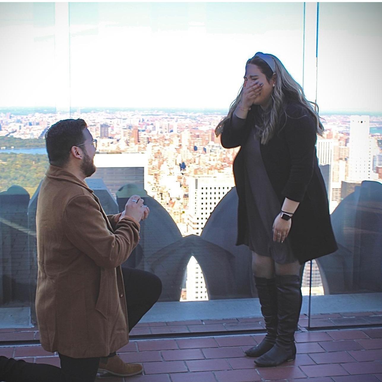 He got down on one knee, and asked "Will you Marry Me" in New York!