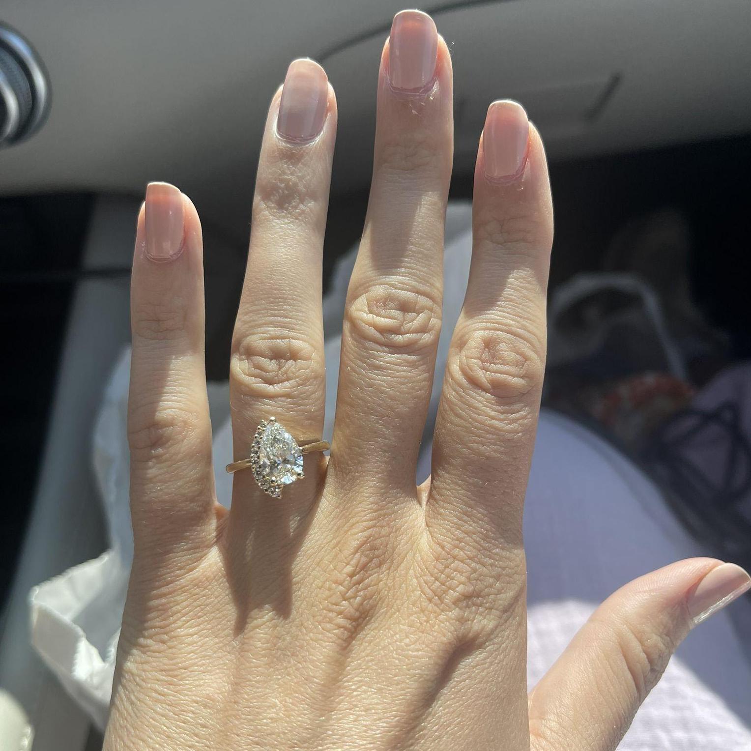 Second LOML: Pear-shaped diamond with asymmetrical row of smaller diamonds!