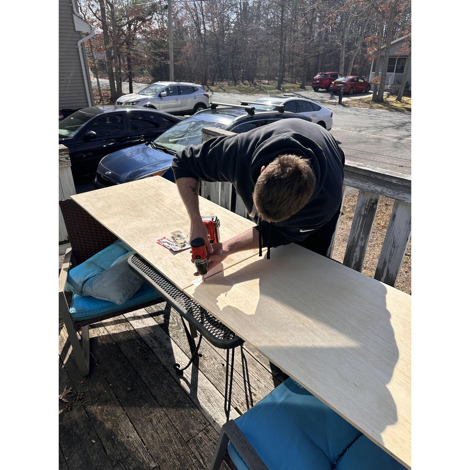 Michael building our wedding sign !