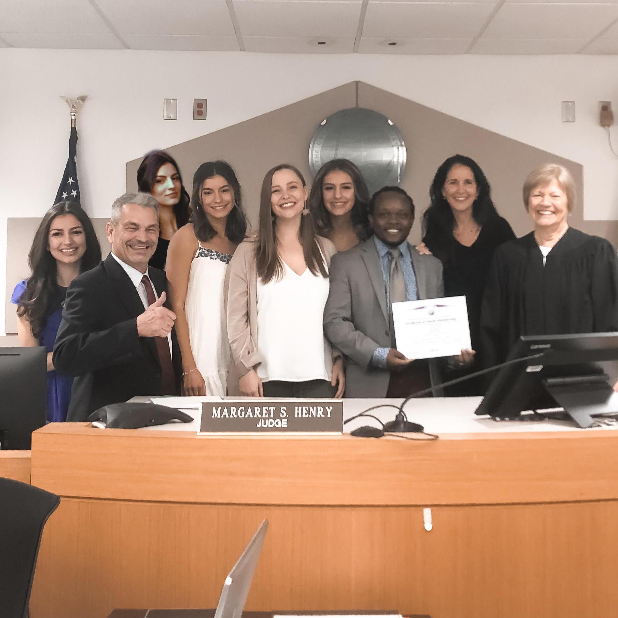 At the adoption of Justice's older brother Enric. From left to right Justice, Johnny (Justice's dad), Promise, Glory, Whitney (sister-in-law), Grace, Enric, Elizabeth (mother)