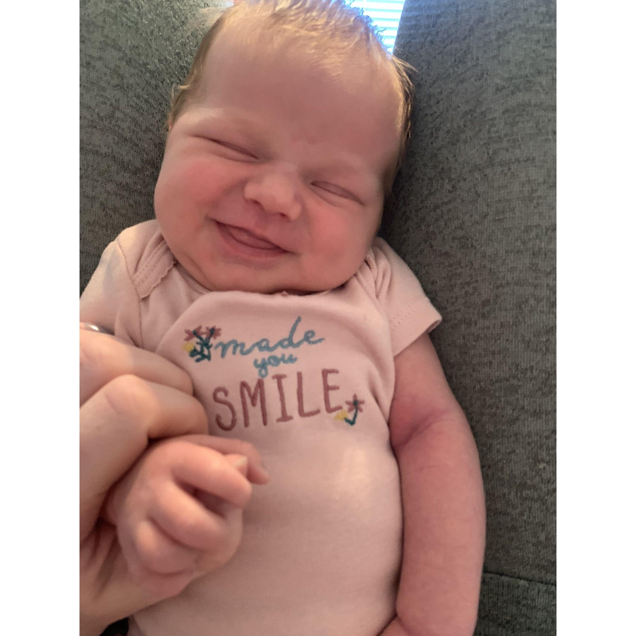 Sleep smile, first on camera smile. So so tiny.