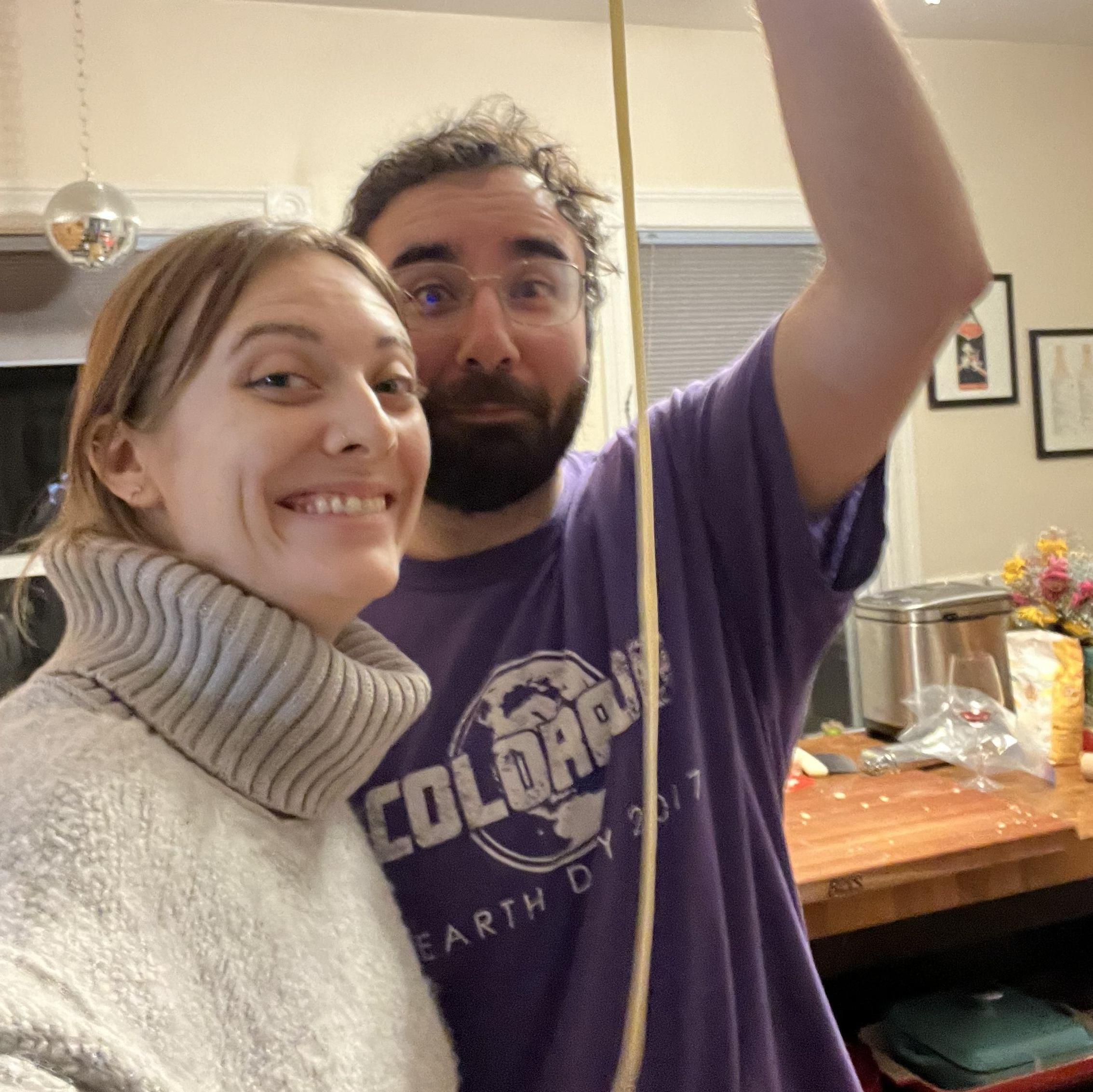 This is the night before Jonathan proposed, making fresh pasta at home together.