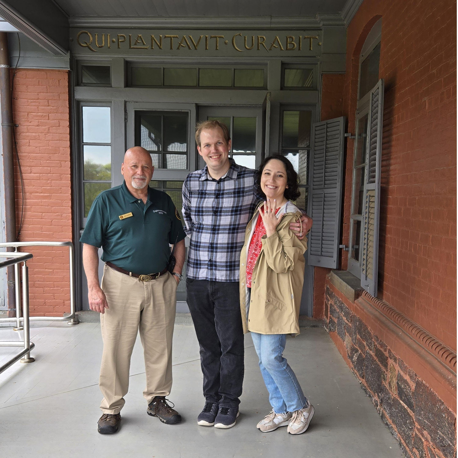 Bella and Mike pose with the Park Ranger who provided their tour of Sagamore Hill that culminated in their engagement.

Fun fact: "Qui plantavit curabit," means "He who will plant will cultivate"