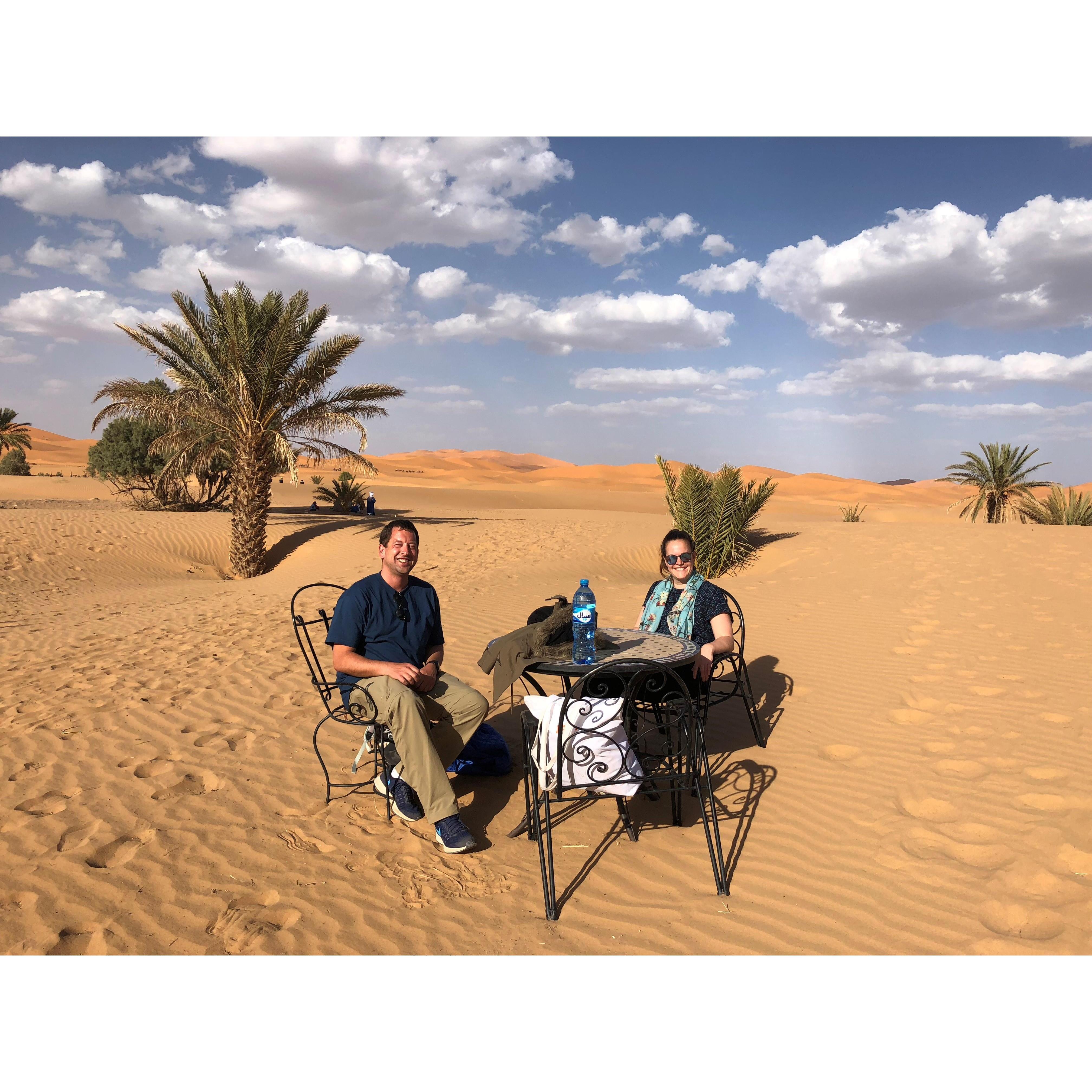 Relaxing before riding camels into the sunset in the Sahara desert
