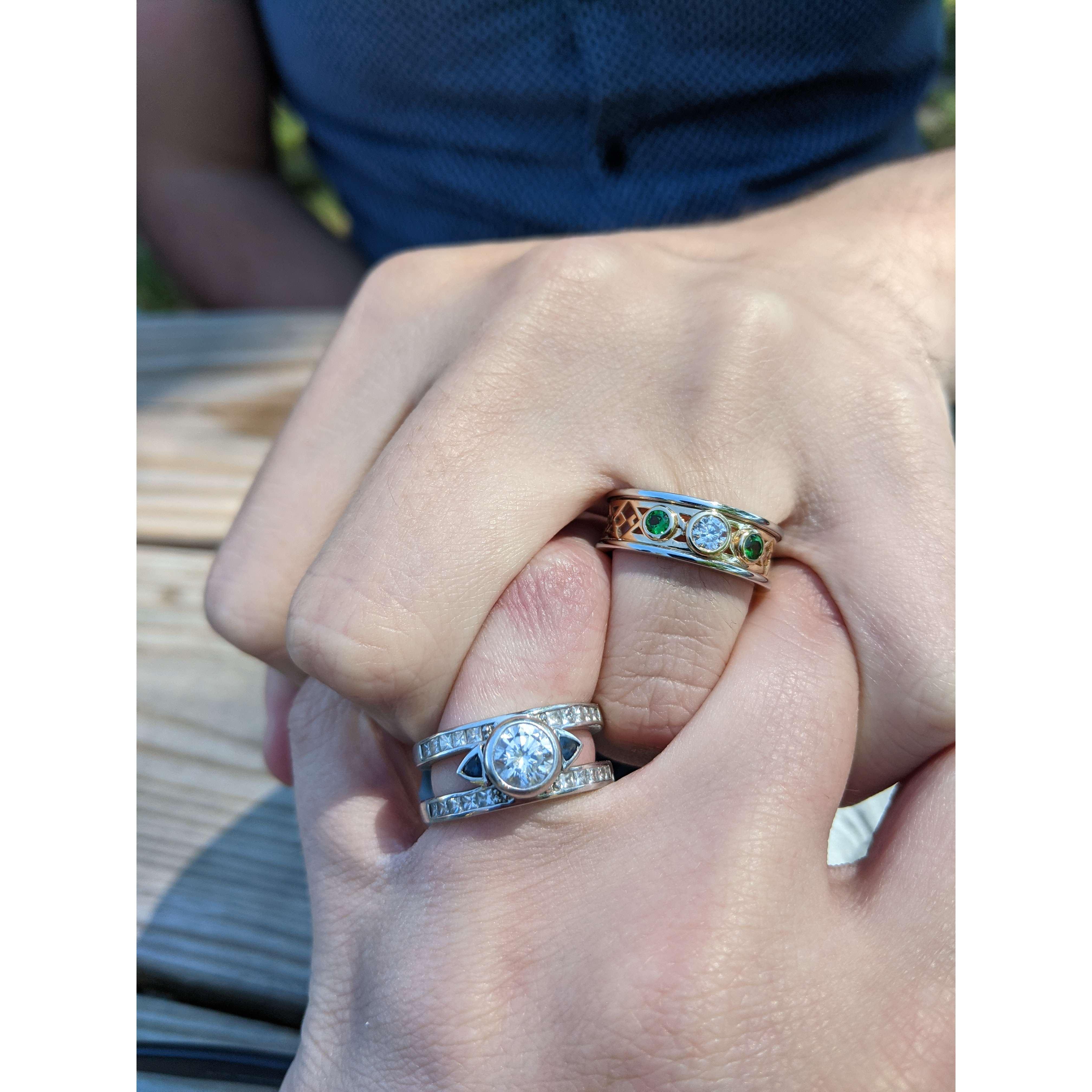 The ring Tom designed incorporated his late grandmother's diamond in the center. Alex designed Tom's ring to reflect the original design