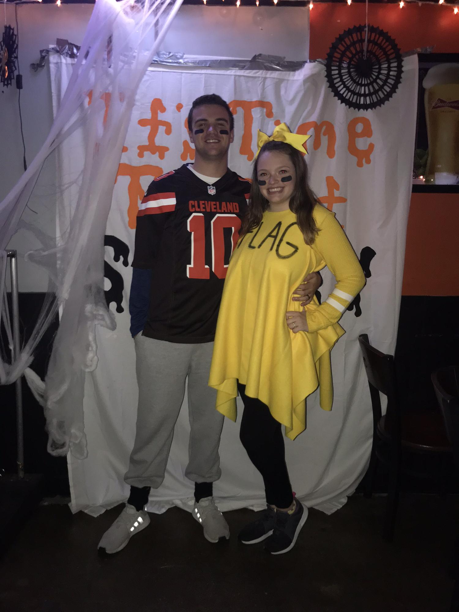 They won best couple costume going as a Browns player and a penalty flag!