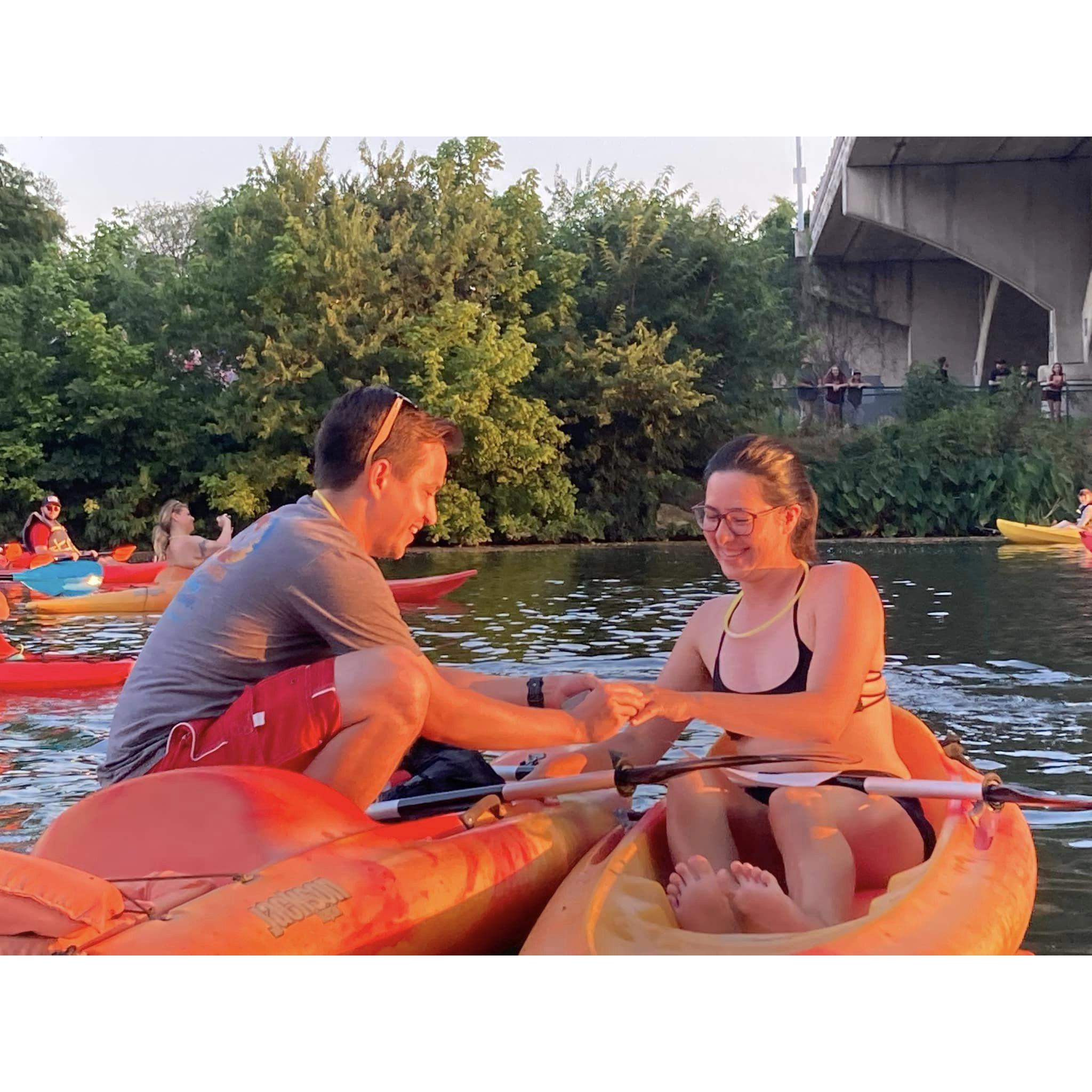 Alex dutifully trying to get on one knee to propose on a kayak.