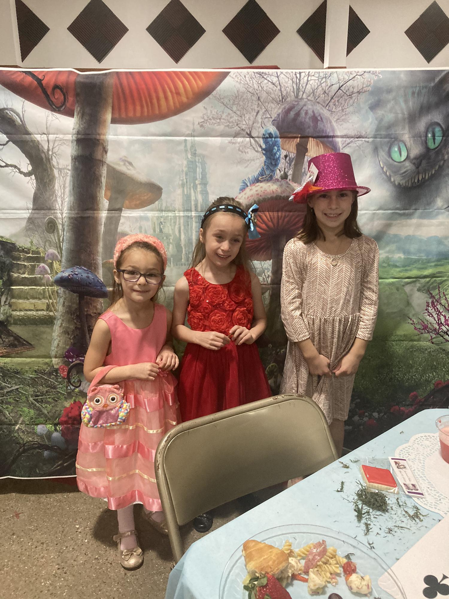 The junior attendants (from left to right): Alethia and Zoe Gordon and Karleigh Toole