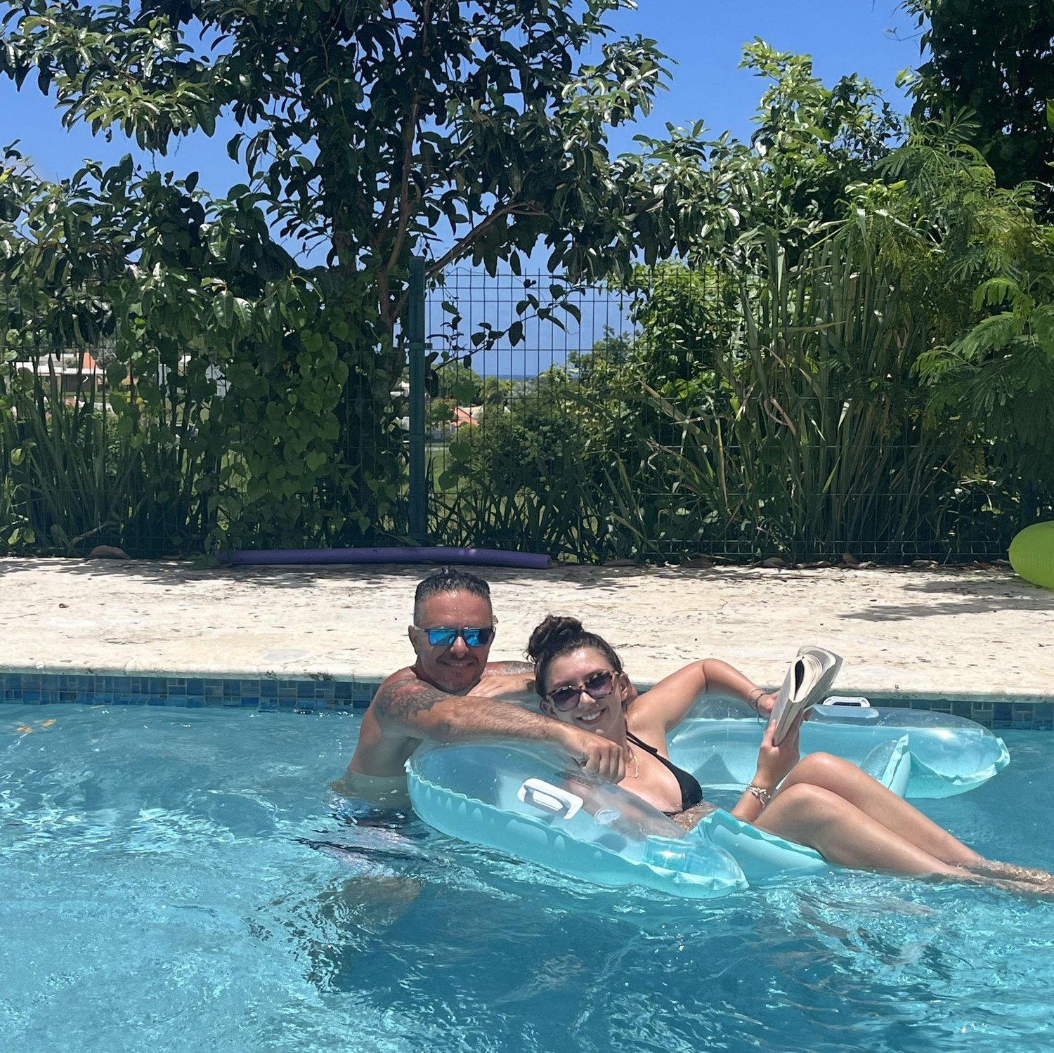 Mike & Mia relaxing in our pool overlooking the Puerto Rico ocean!