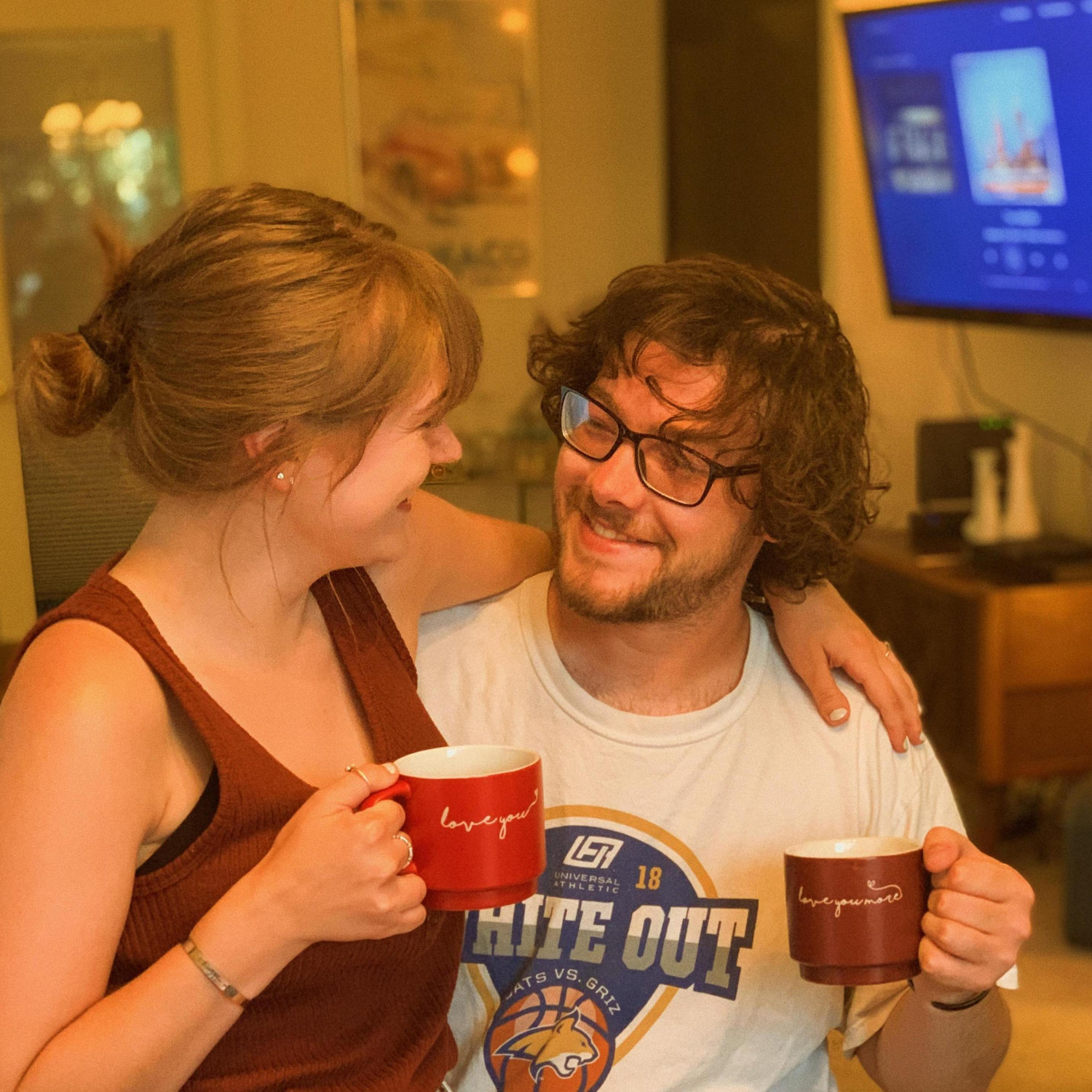 Winter 2020. M bought cute couple's mugs, dumped a cocktail in them, and convinced H to pose for this adorable pic. She regrets nothing.