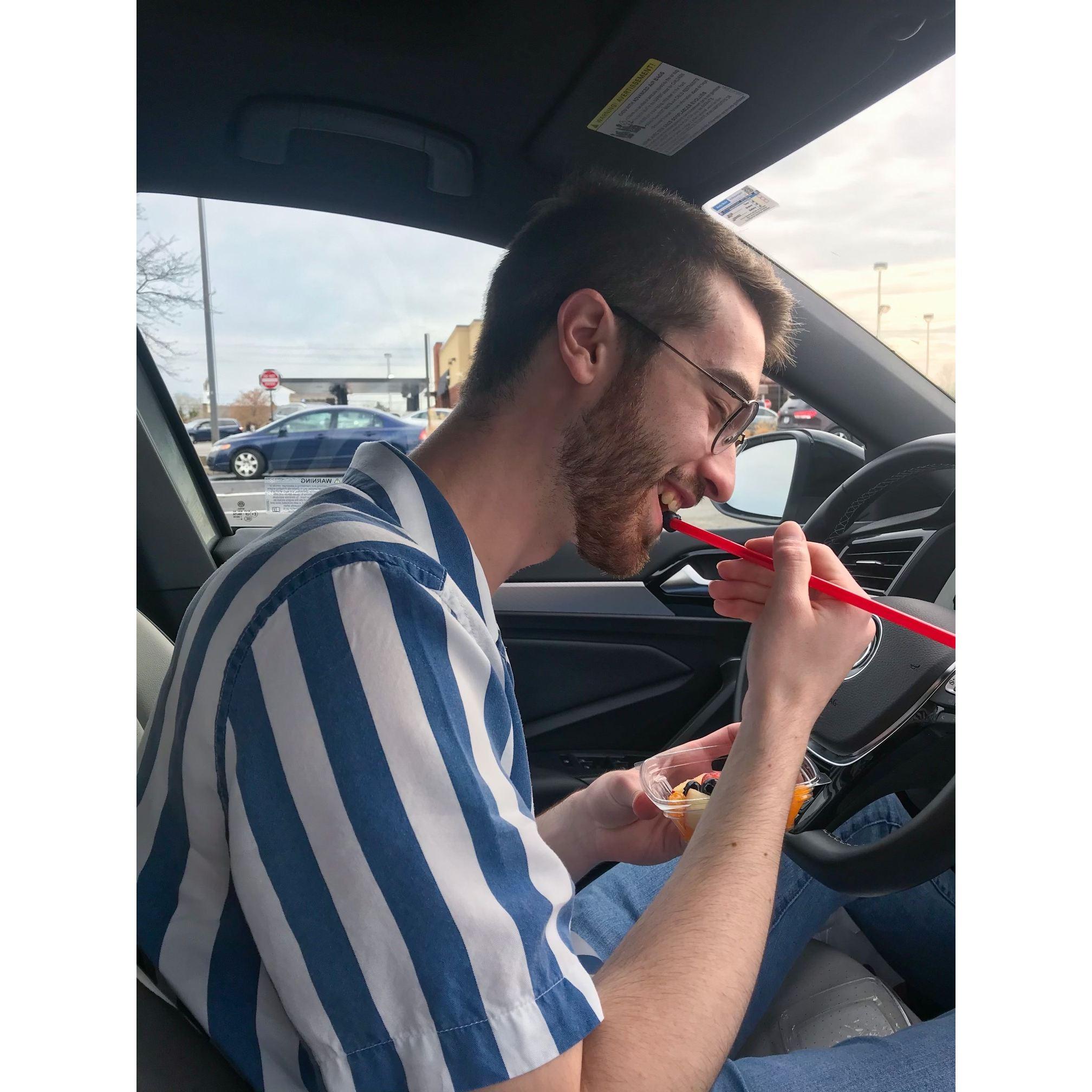 The first day we met in person - he didn't have a fork so he ate his fruit with a straw!