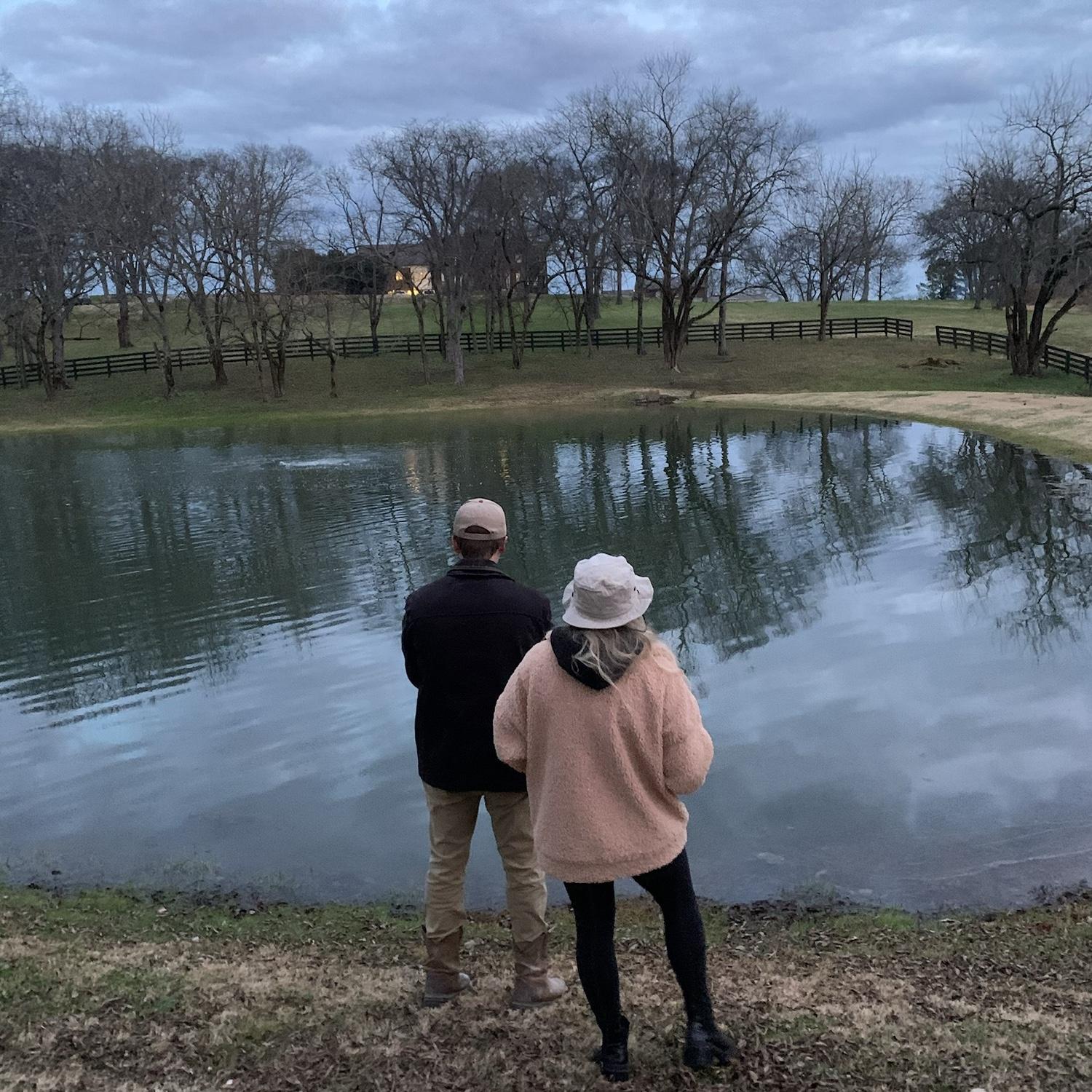 One of our very first memories/photos! 
On a cold December afternoon, John planned a fishing excursion for a few friends. We both ended up jumping in the pond after we both had lost what are the odds