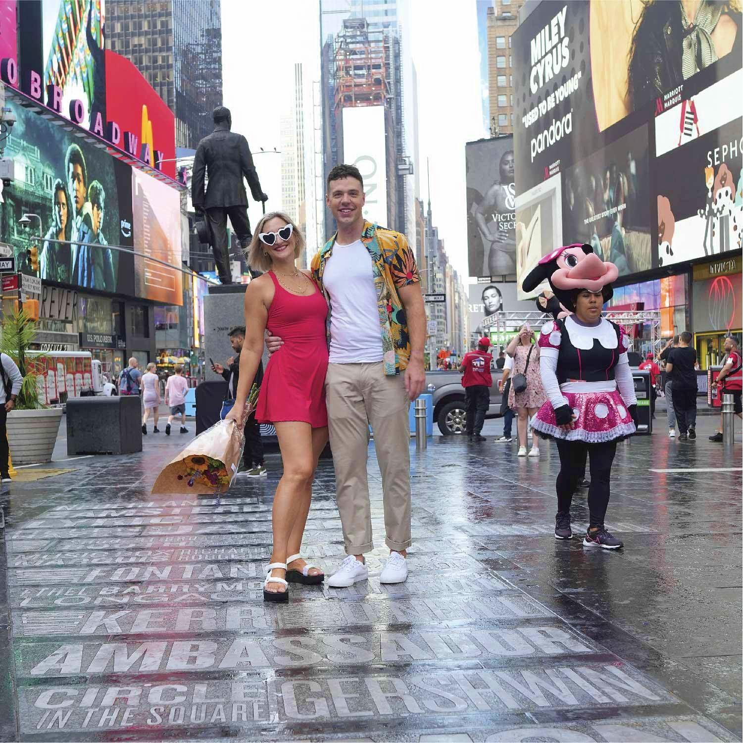 We walk through Times Square every morning! One of our favorite engagement shots