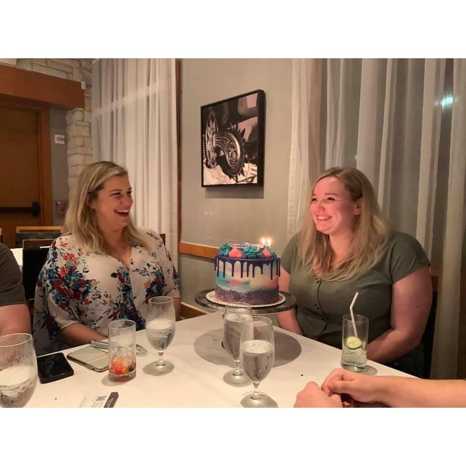 Suprising Kait with a lovely cake for her birthday at our friend group dinner (a/k/a getting the meat sweats) at Fogo de Chao in Houston in March 2021.