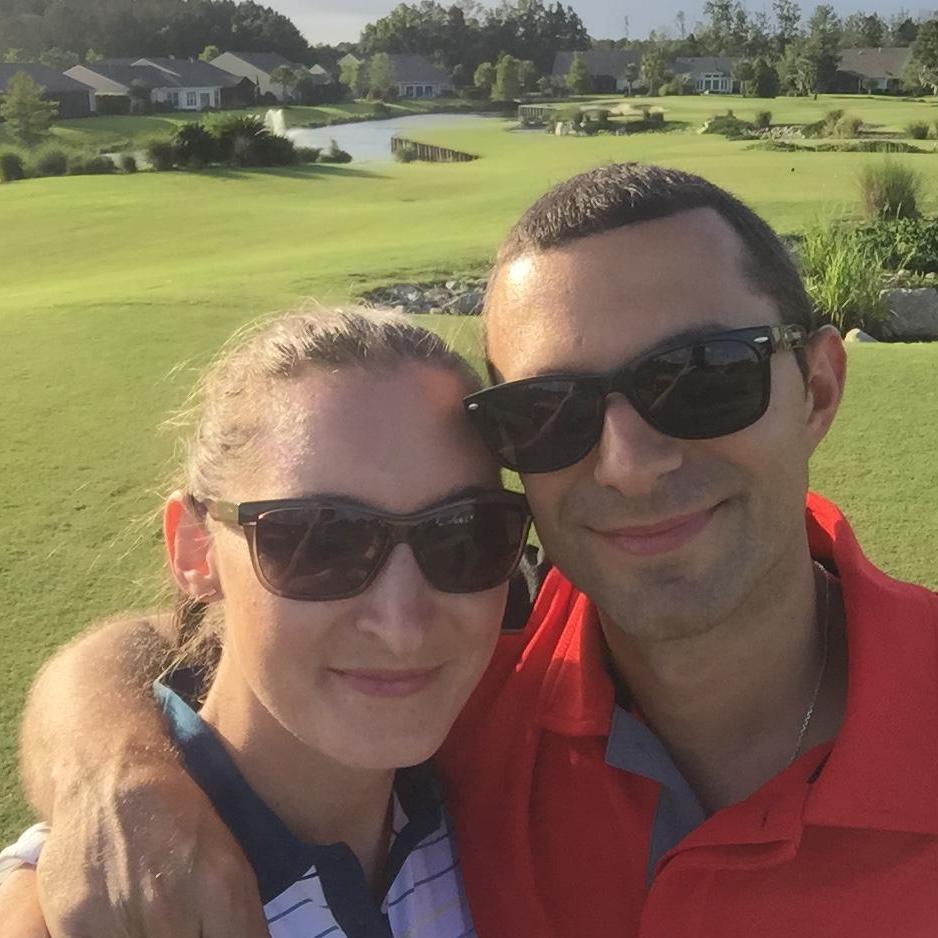 Golfing together!!! Well..... he golfed, she did cartwheels